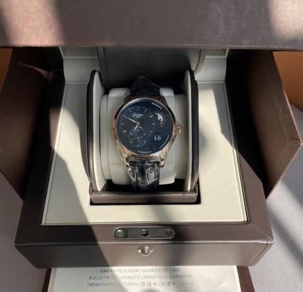 May be an image of wrist watch and text