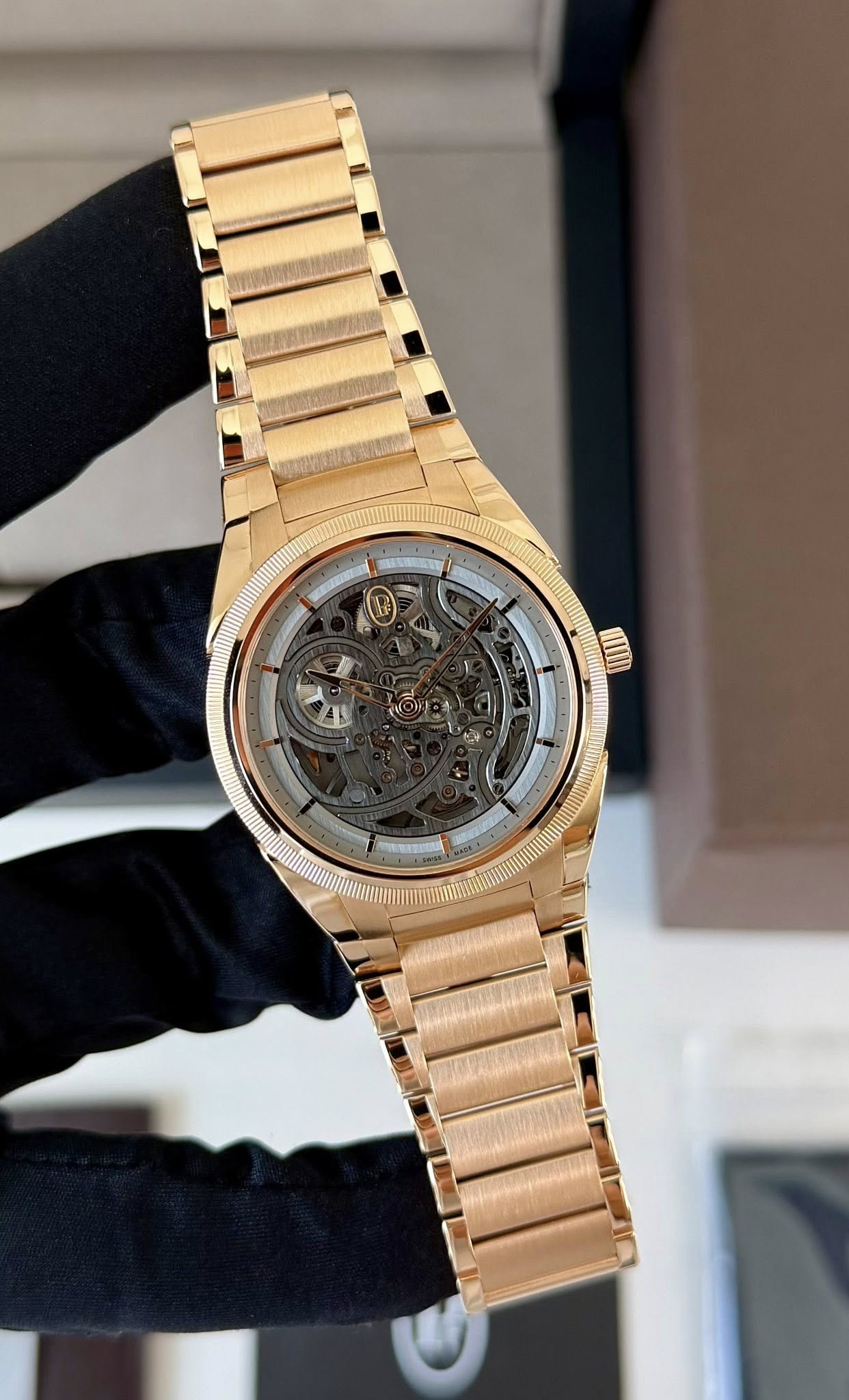 May be an image of wrist watch and text