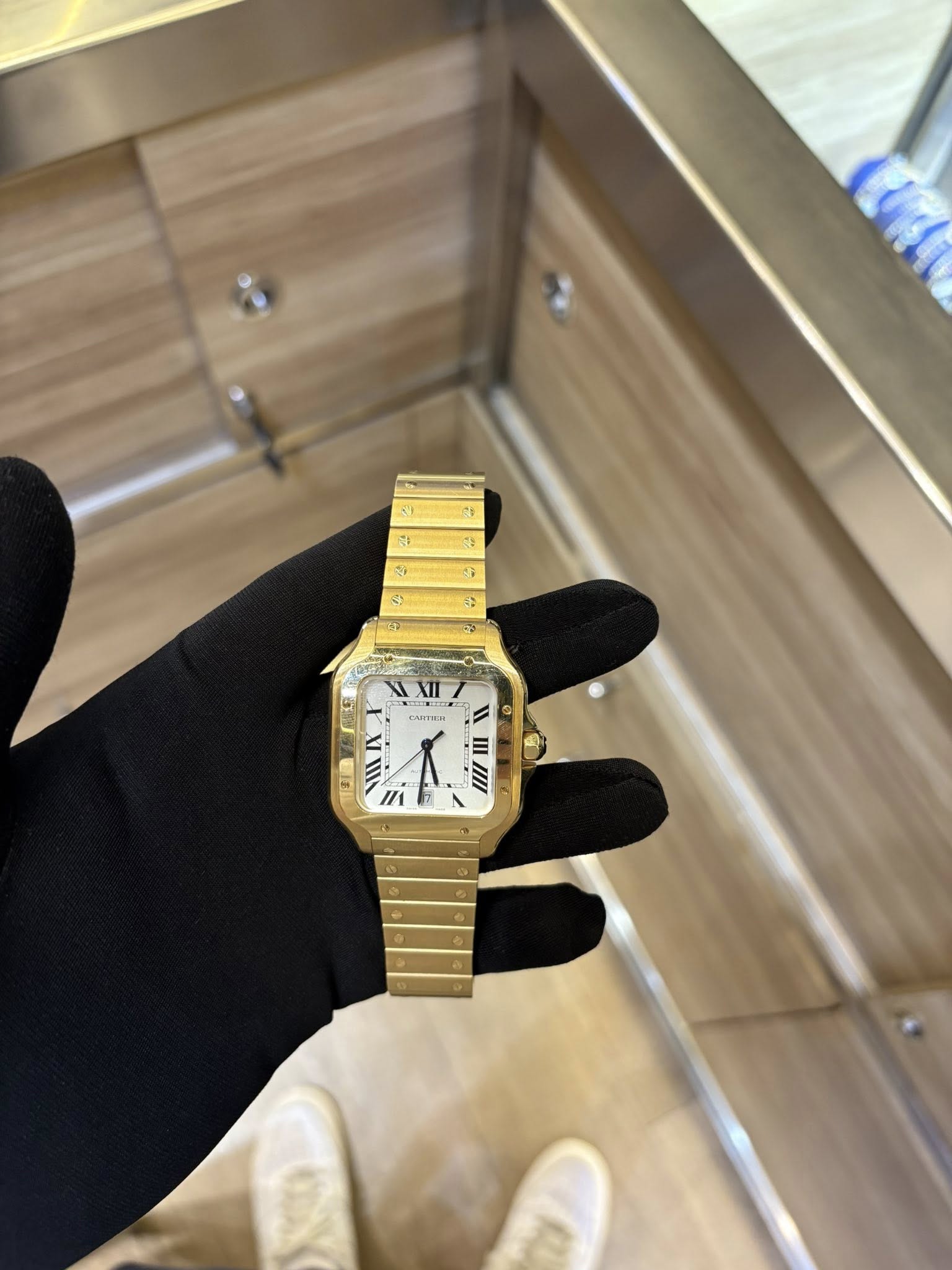 May be an image of wrist watch and text