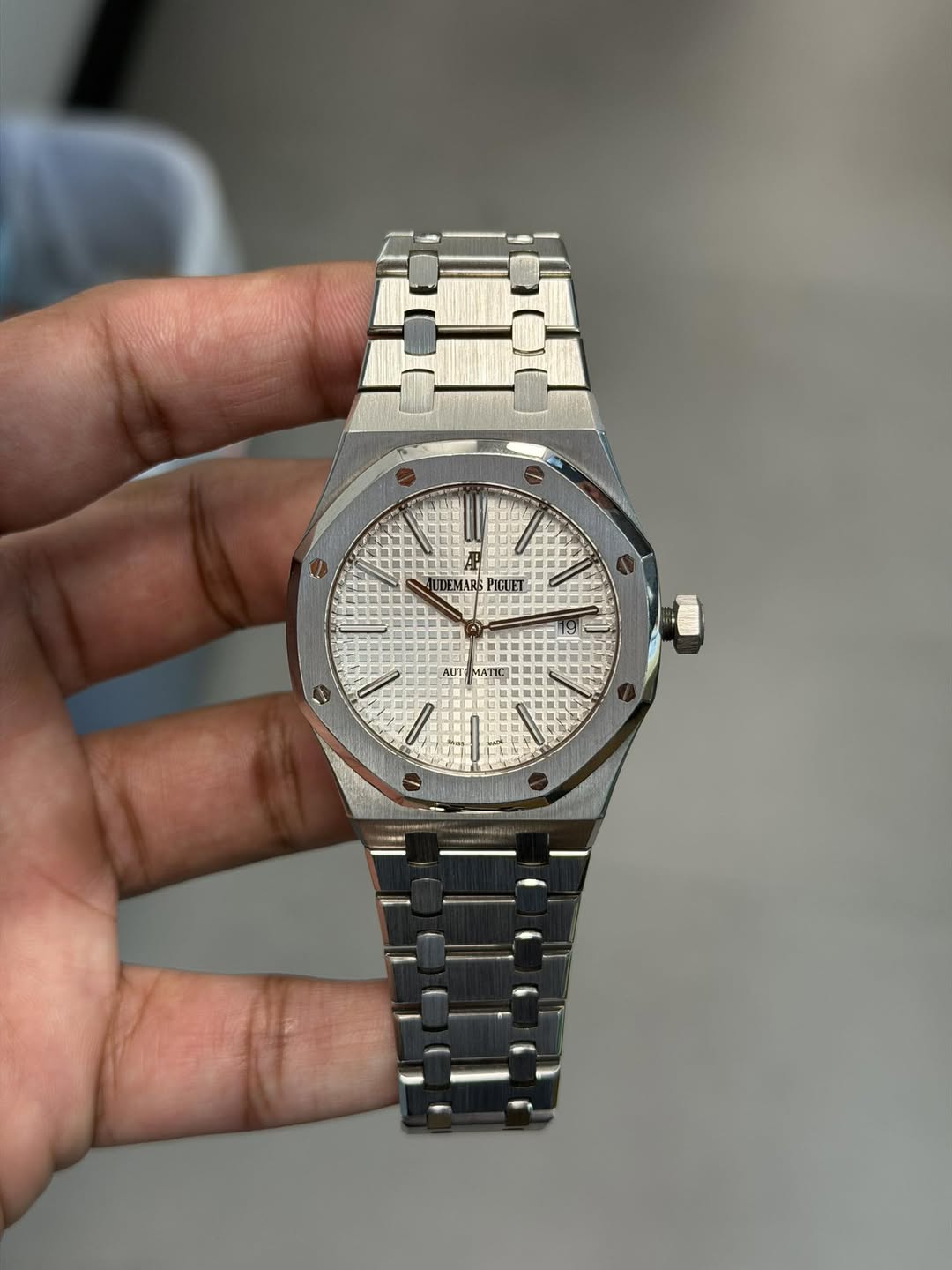 May be an image of wrist watch and text