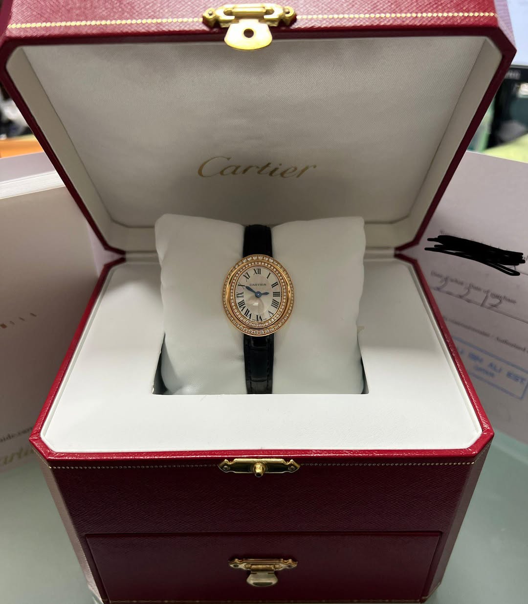 May be an image of wrist watch and text that says '1 XI XII ቅአያ'