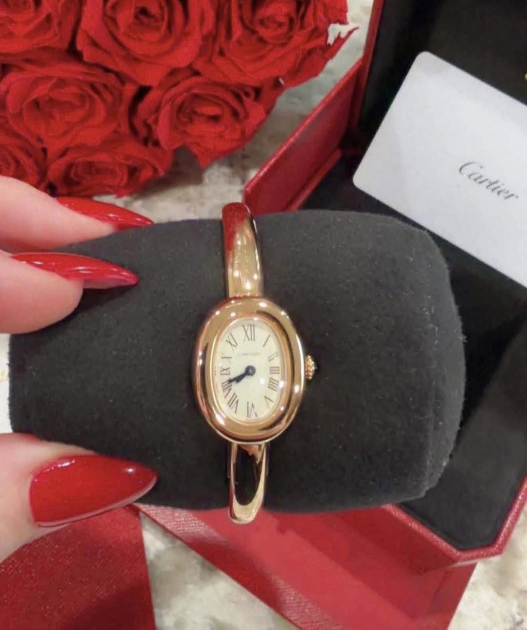 May be an image of wrist watch and text that says 'Cartier Cartier J XII - ط 8 E VI IIA ۱۸ M'