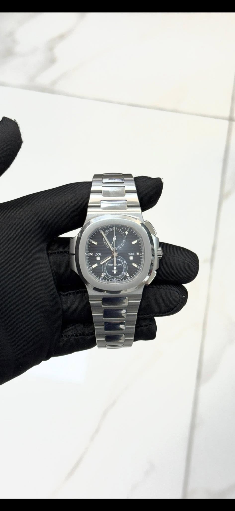 May be an image of wrist watch and text