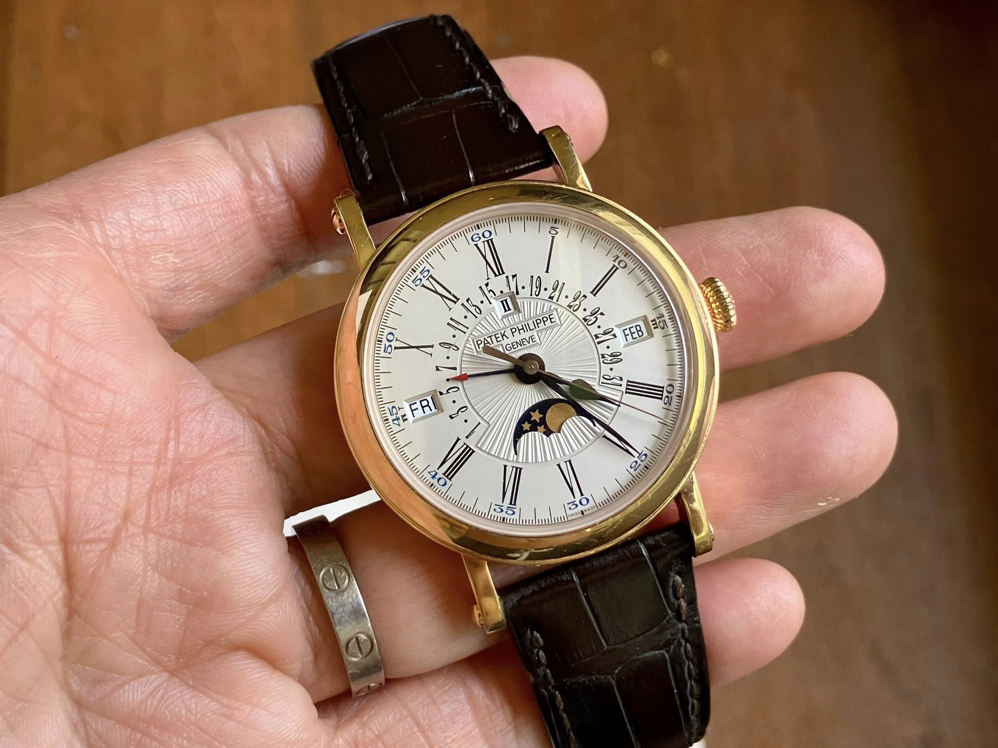 May be an image of wrist watch and text