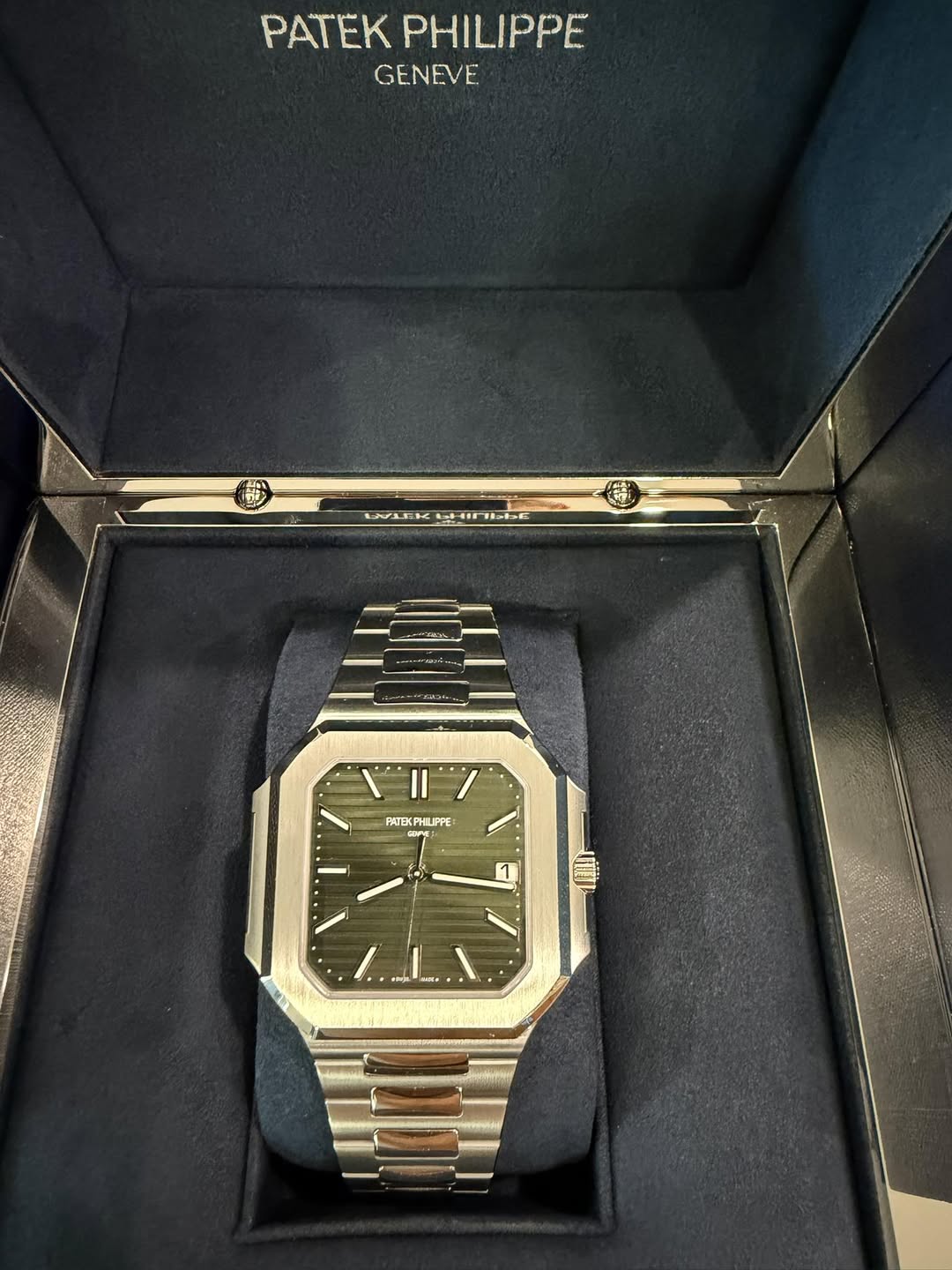 May be an image of wrist watch and text
