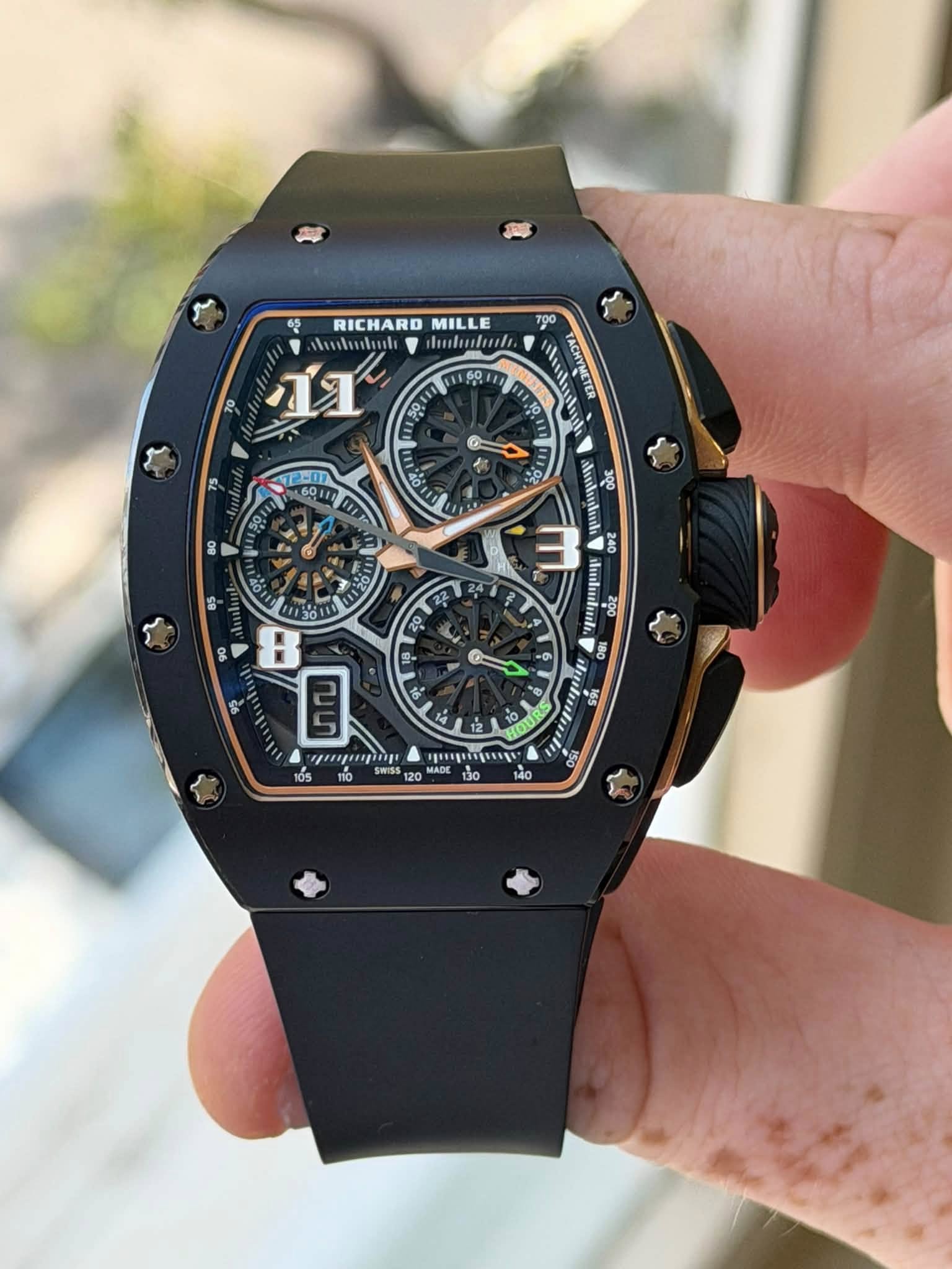 May be an image of wrist watch and text