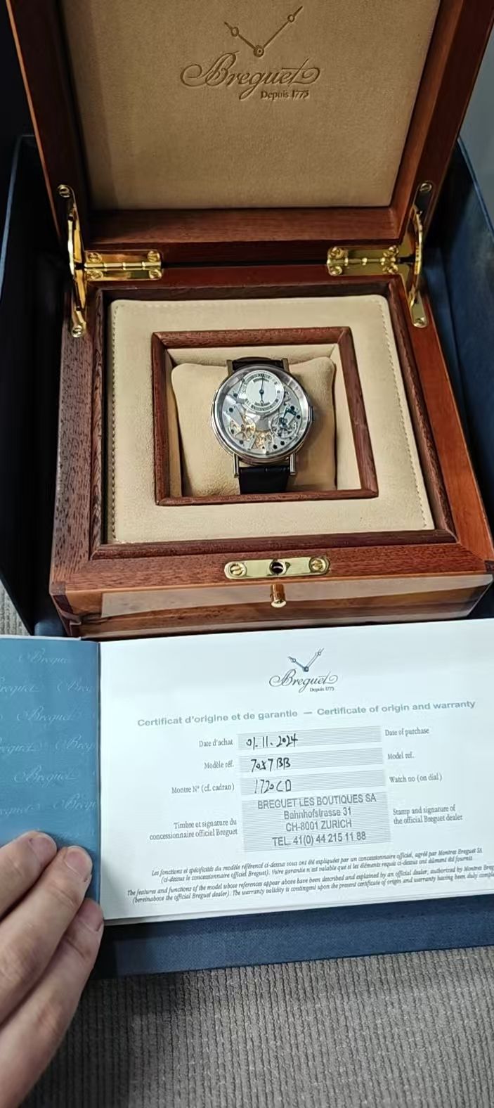 May be an image of wrist watch and text