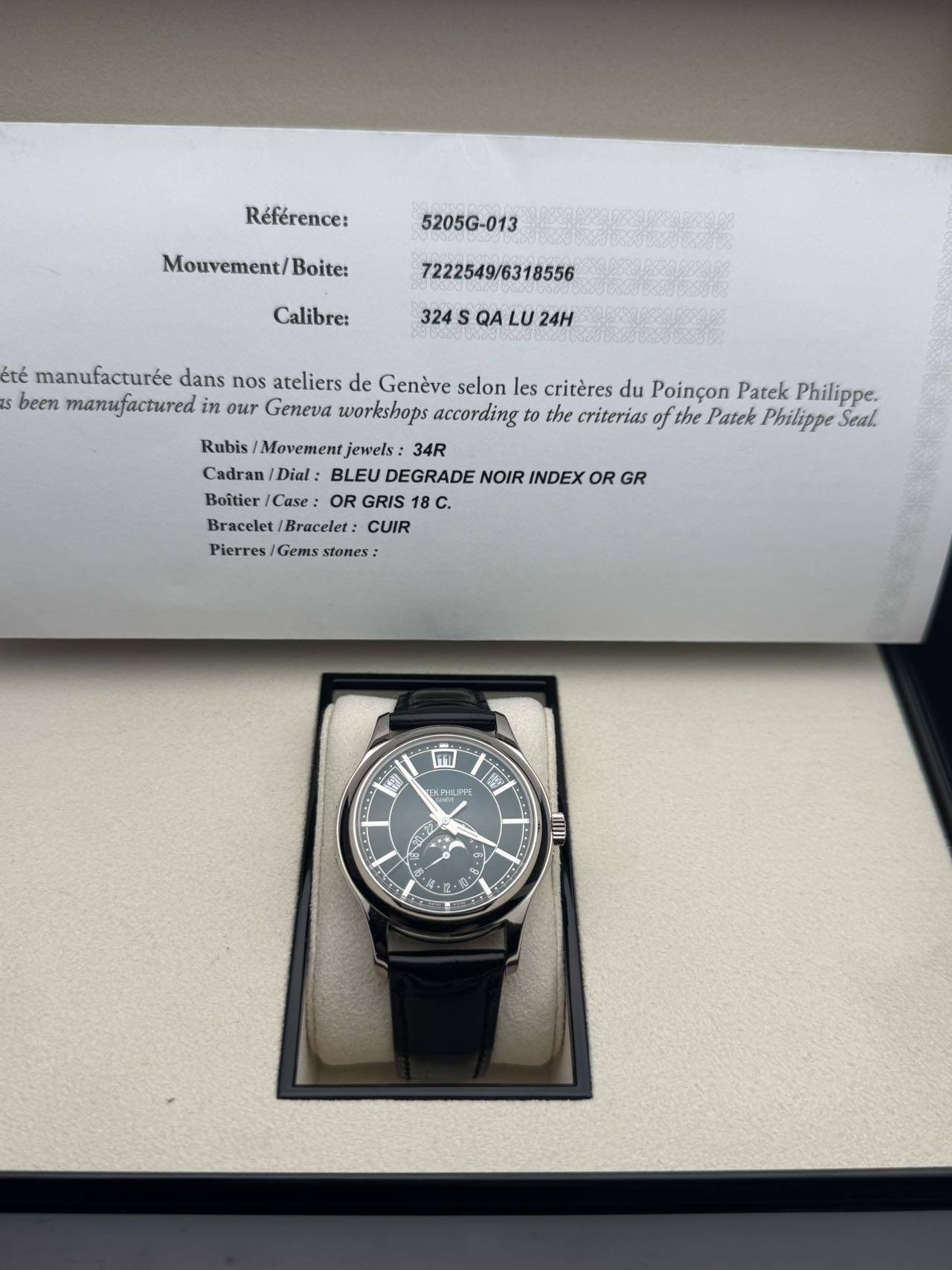 May be an image of wrist watch and text that says 'Référence: 5205G-013 Mouvement/ Boite: Calibre: 7222549/ 24H été manufacturée dans nos ateliers de Genève selon les critères…