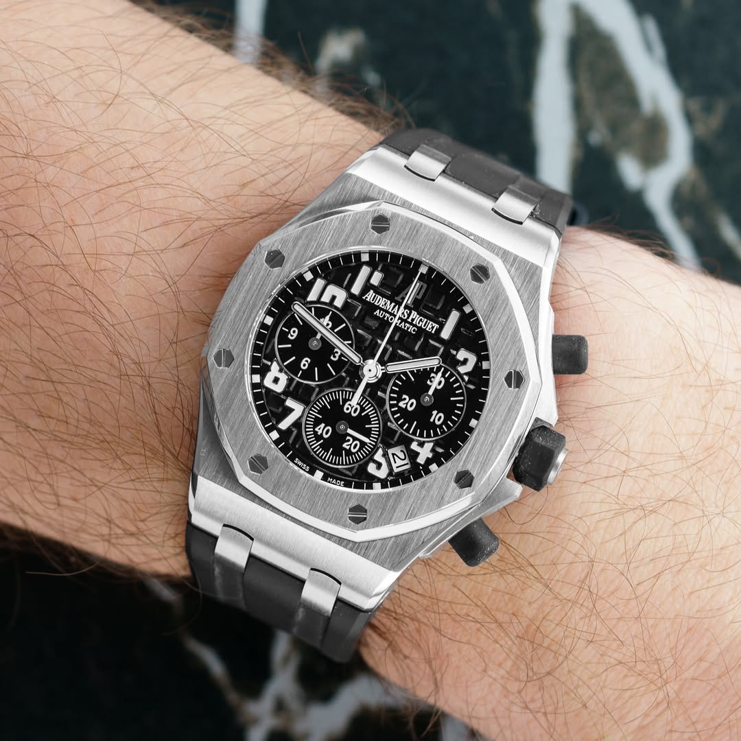 May be an image of wrist watch and text