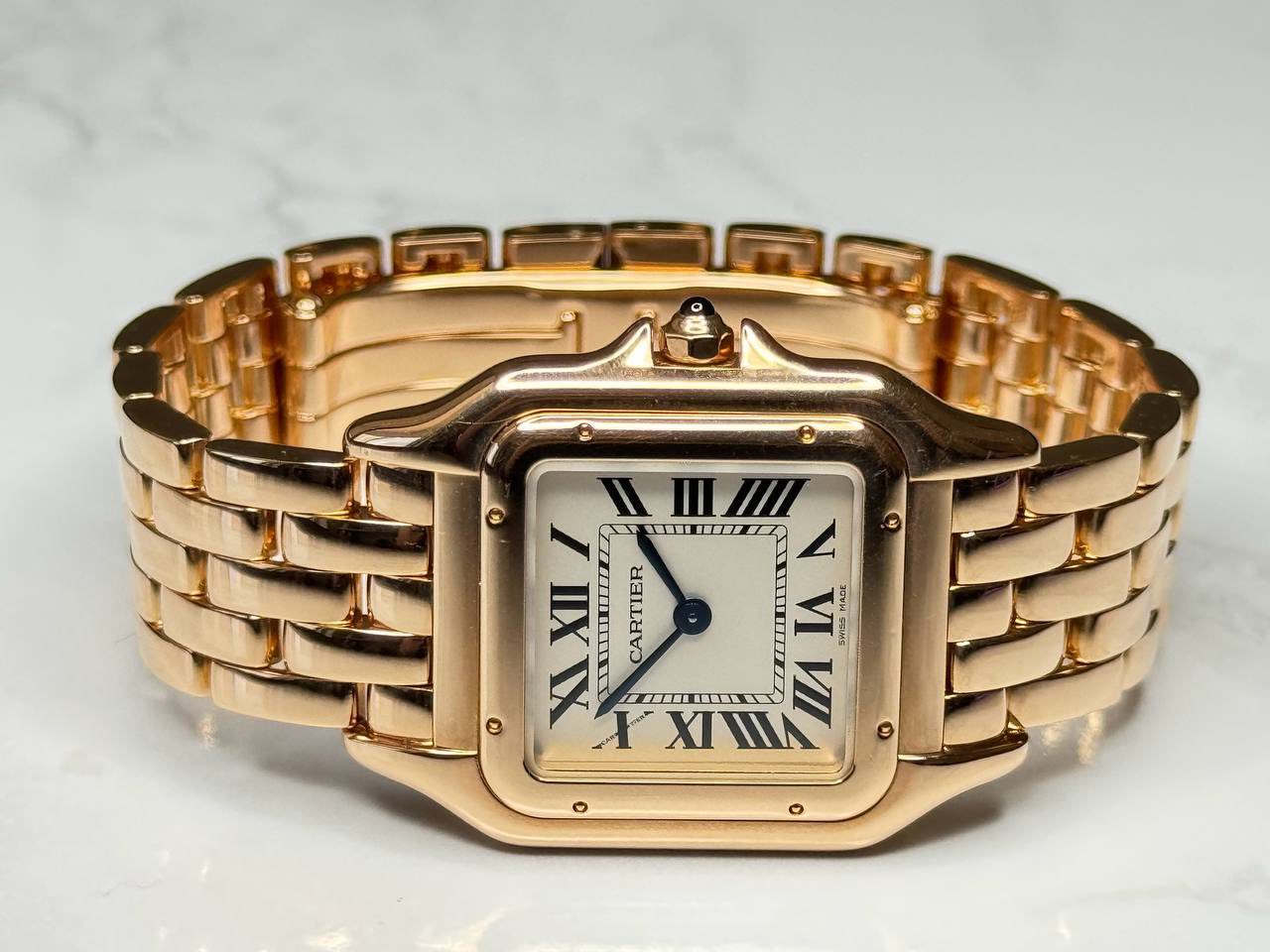 May be an image of wrist watch and text