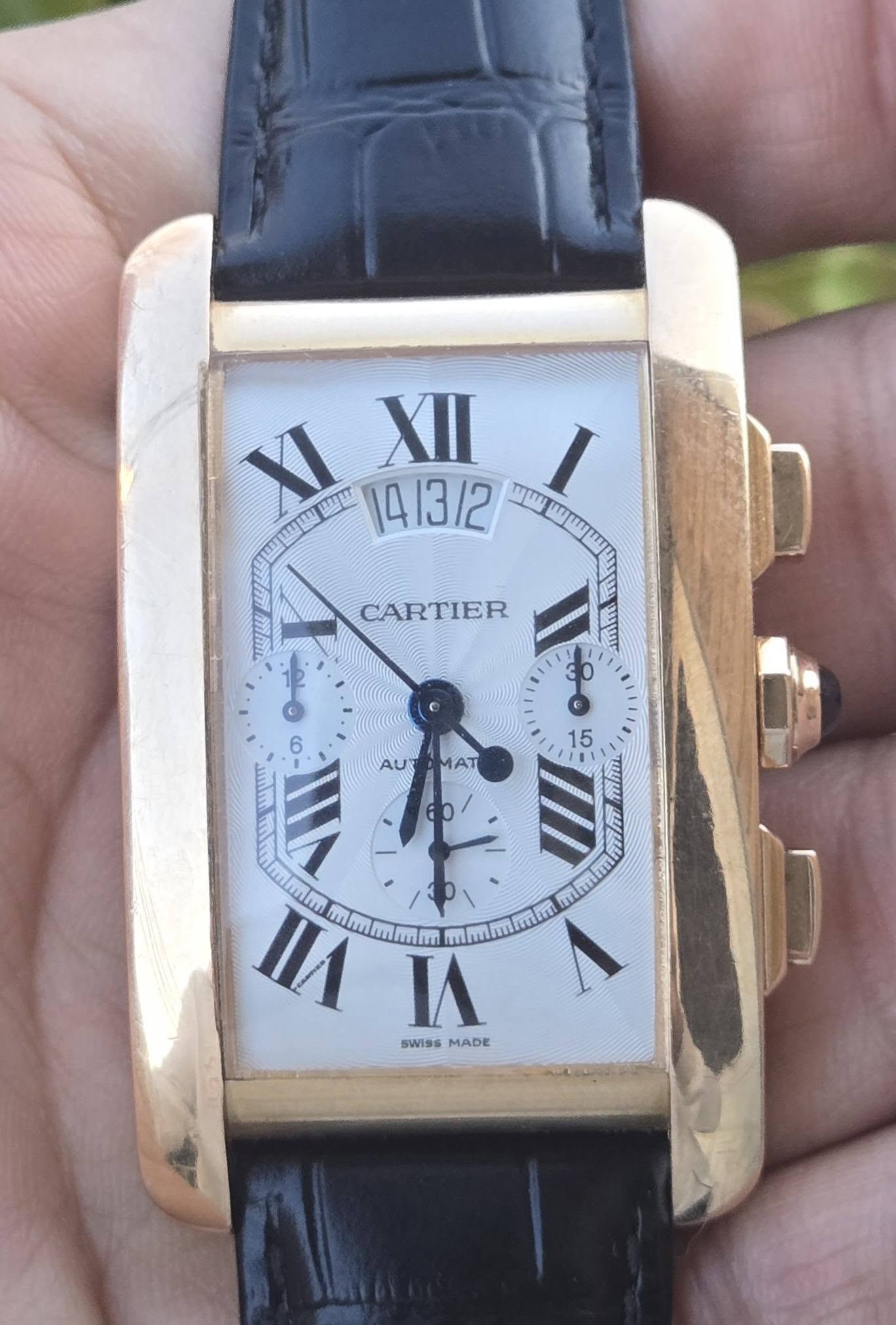 May be an image of wrist watch and text