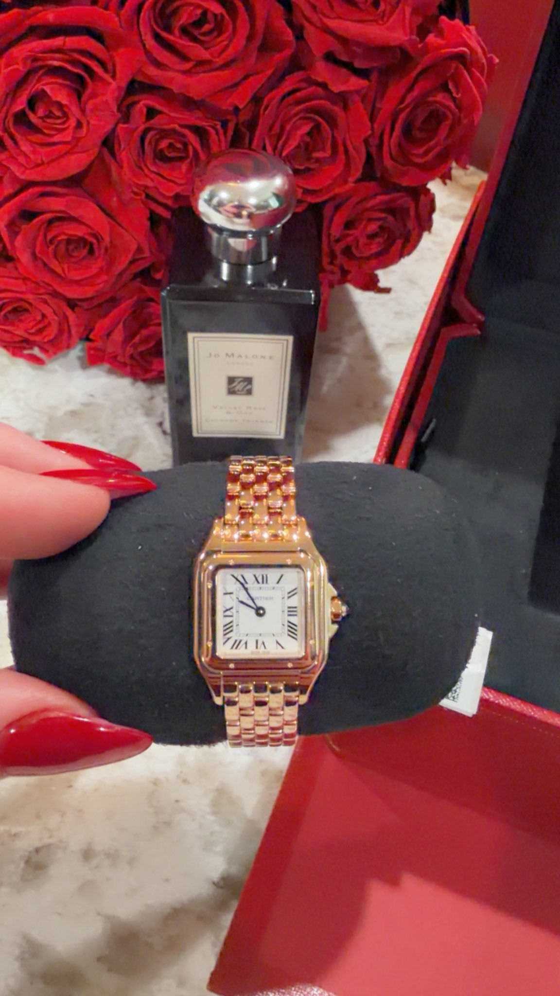 May be an image of fragrance, wrist watch and text