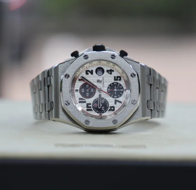 May be an image of wrist watch and text