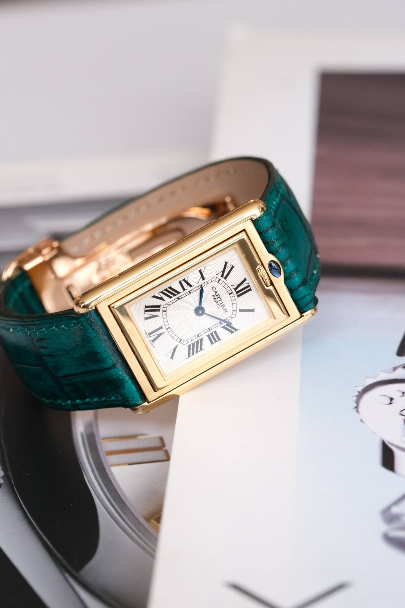 May be an image of wrist watch and text