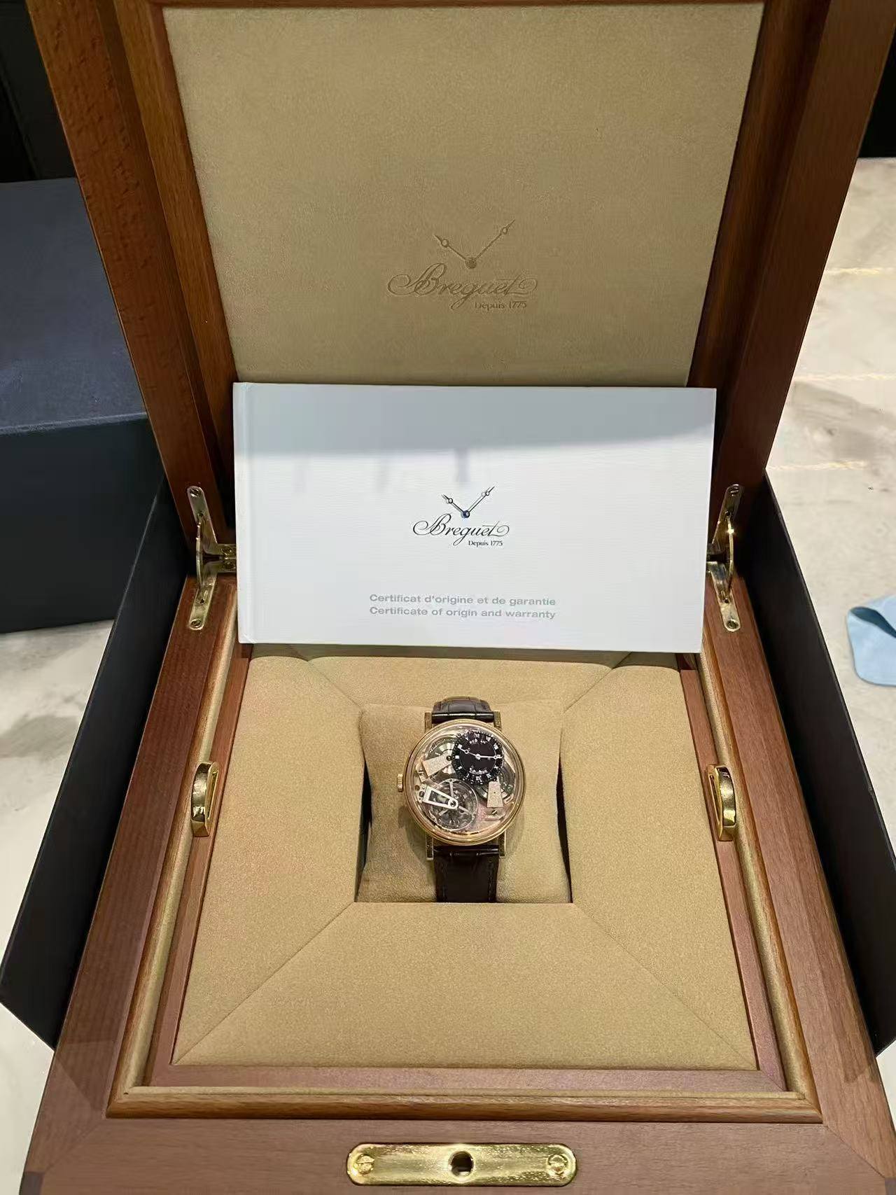 May be an image of wrist watch and text