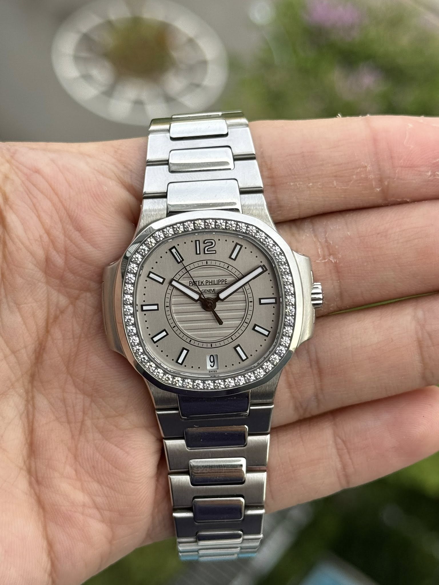 May be an image of wrist watch and text