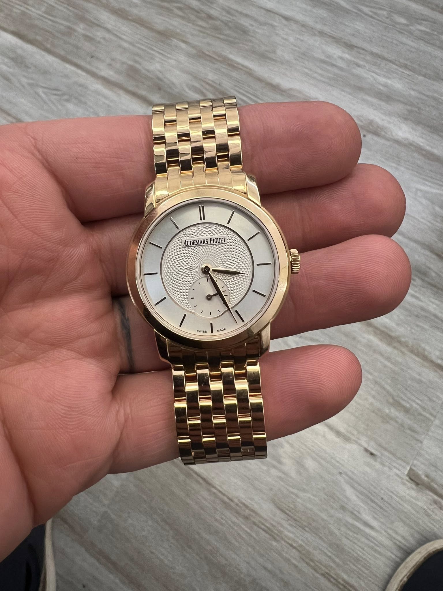 May be an image of wrist watch and text