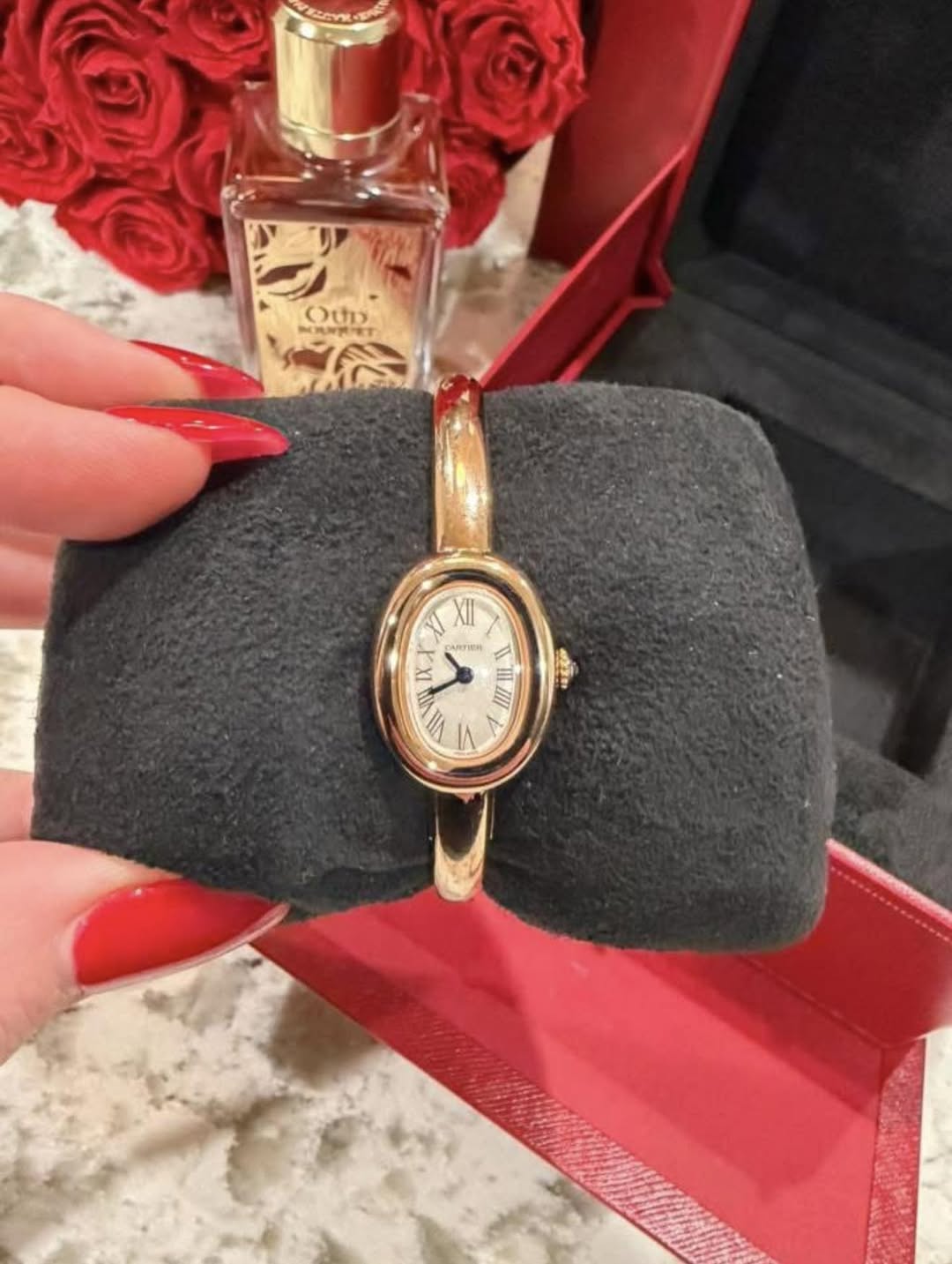 May be an image of wrist watch, fragrance and text