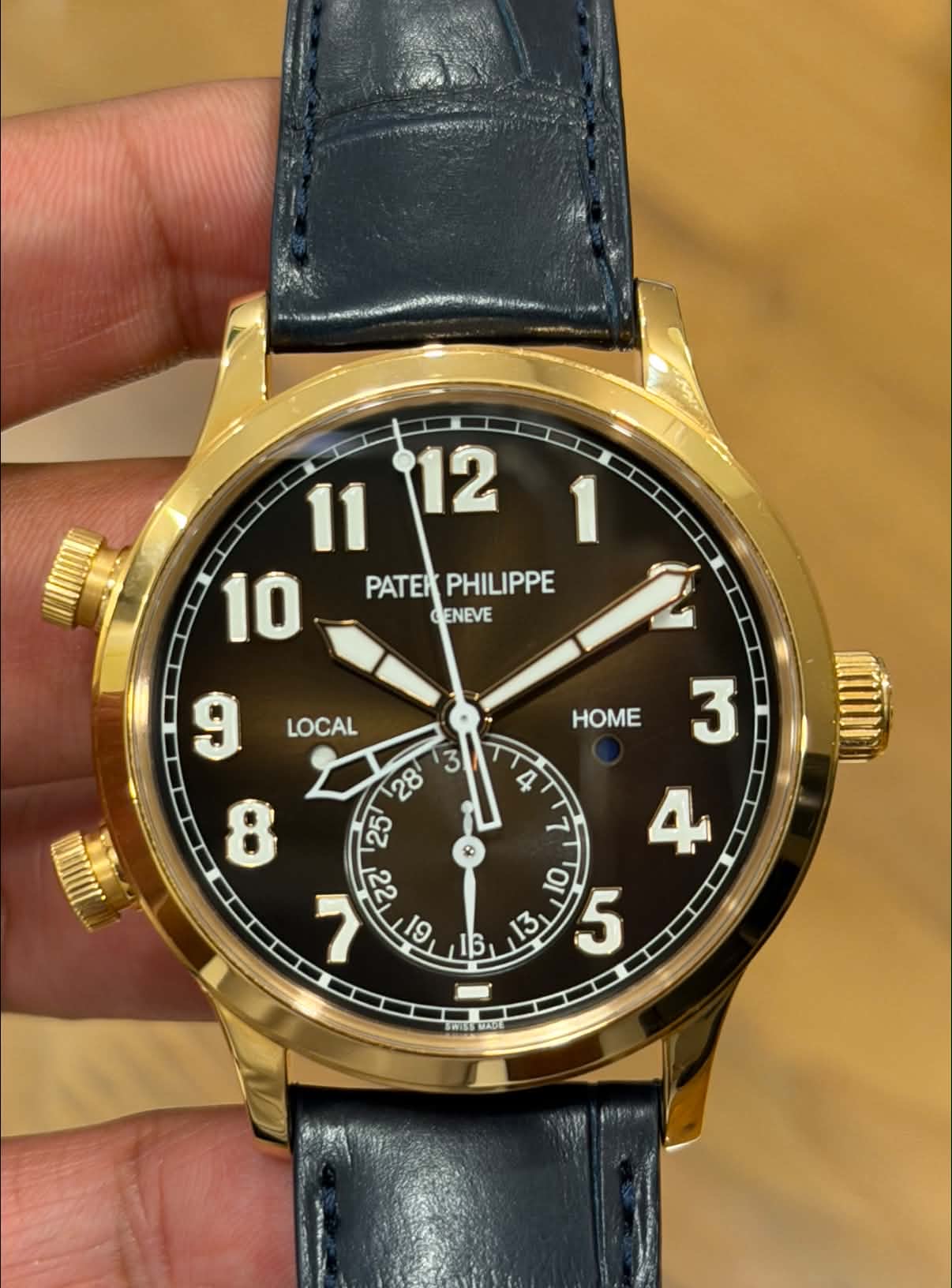 May be an image of wrist watch and text that says ' PATER PHILIPPE GENEVE LOCAL HOME 3 4 N በስዝ $ G GI ਟਣਾ 9 4 OI 5'