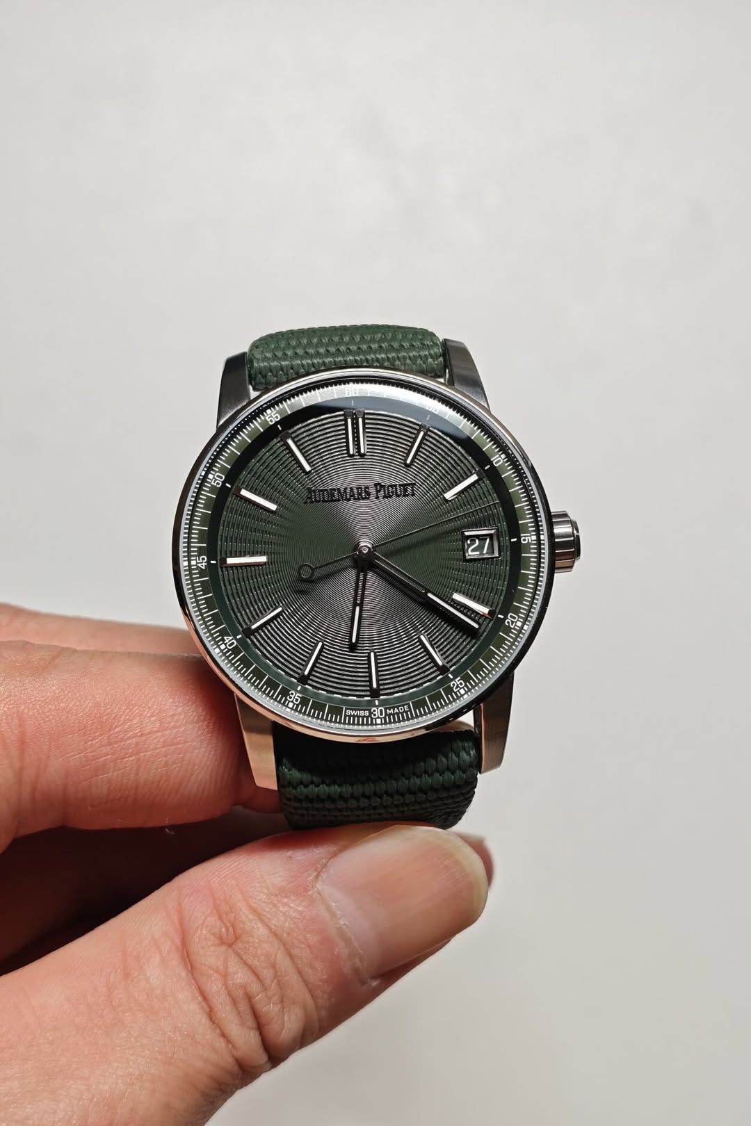 May be an image of wrist watch and text