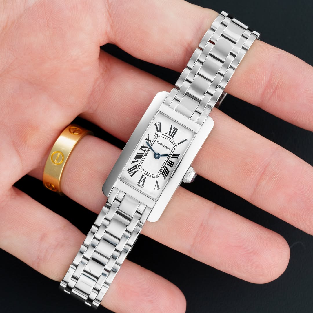 May be an image of wrist watch and text