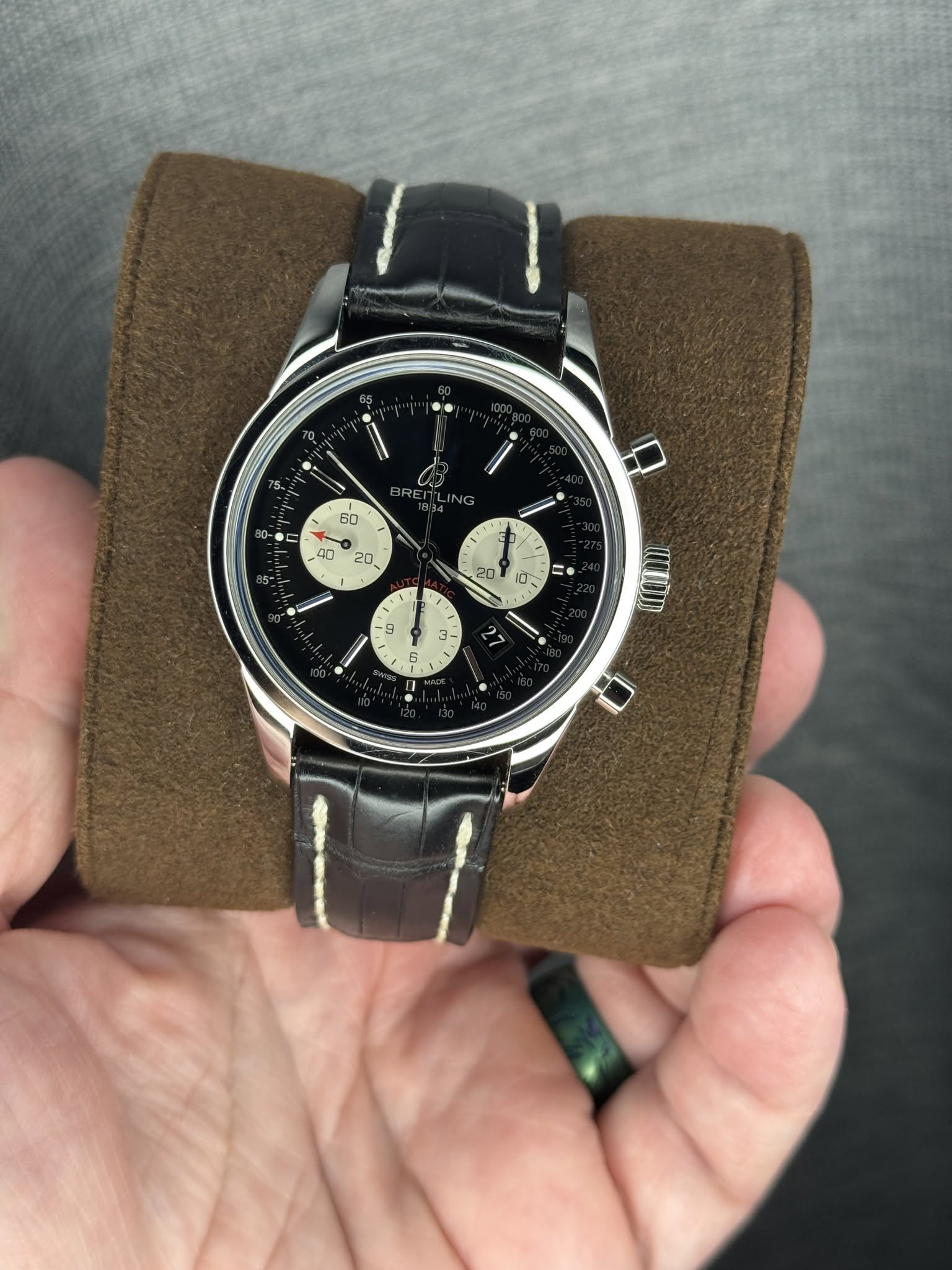 May be an image of wrist watch and text