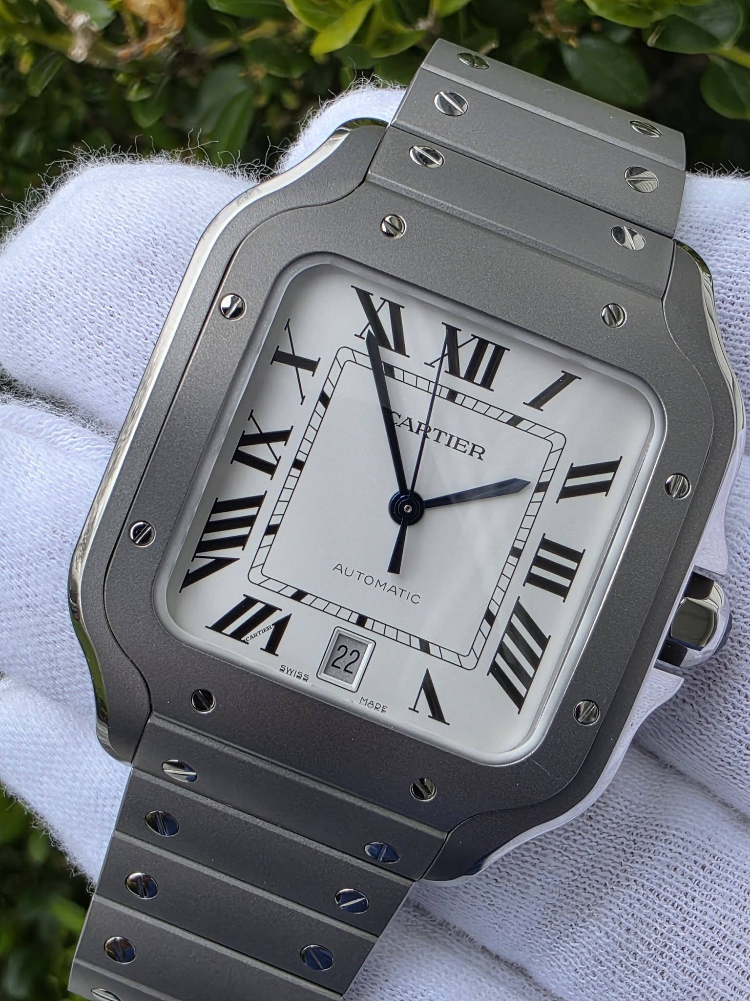 May be an image of wrist watch and text