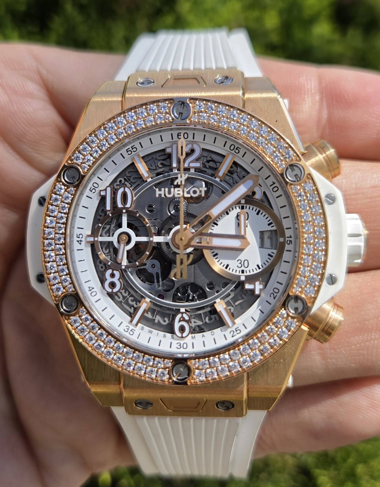 May be an image of wrist watch and text