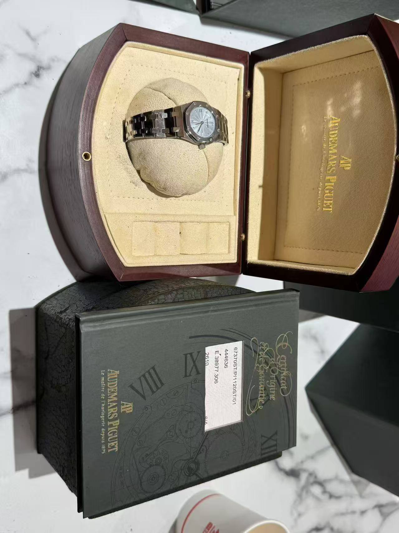 May be an image of wrist watch and text