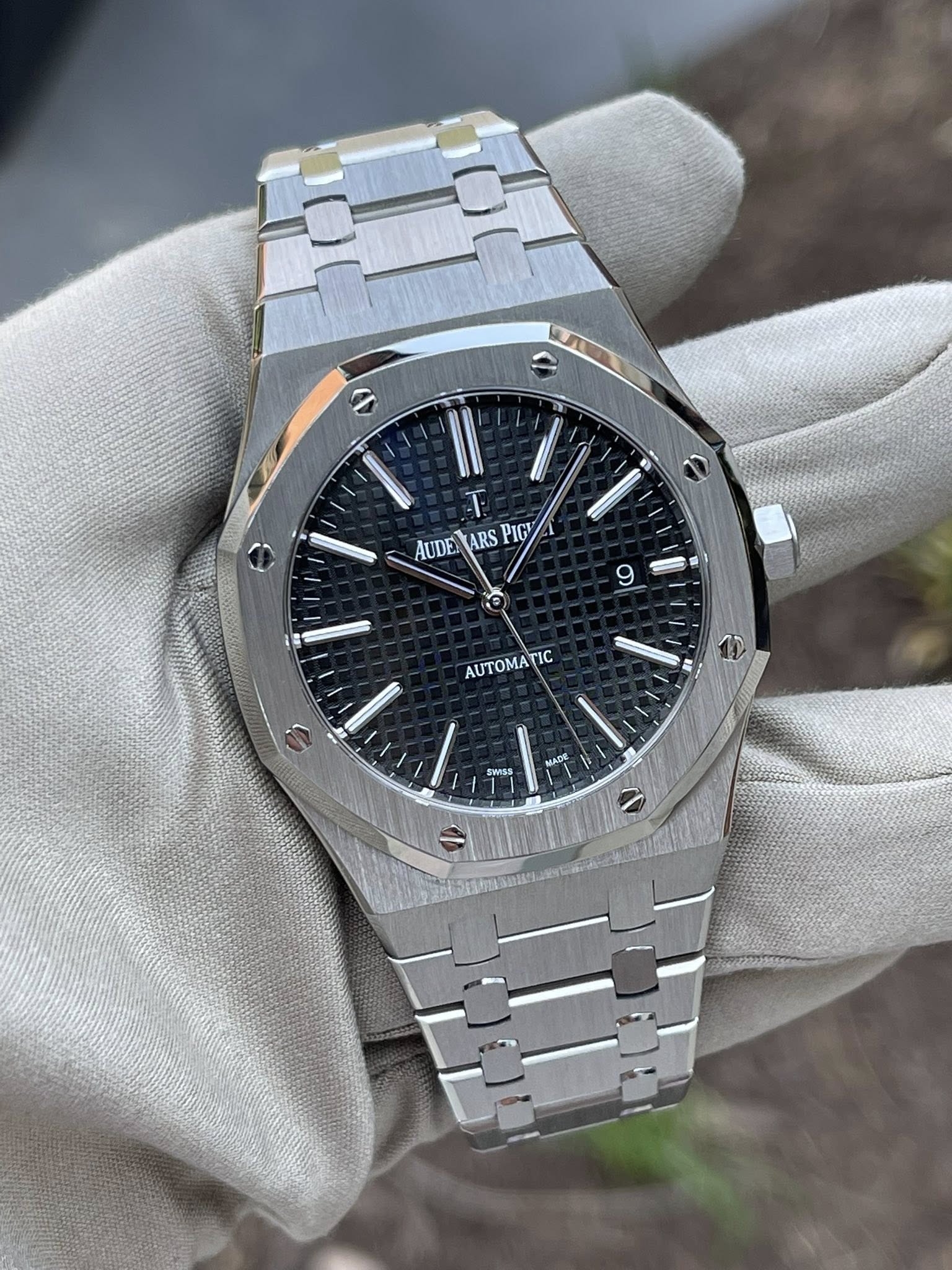 May be an image of wrist watch and text that says 'T AUDE AUDETARS RS UDETARSPICA PIC 9 AUTOMATIC TIC 9s WISS KADE'