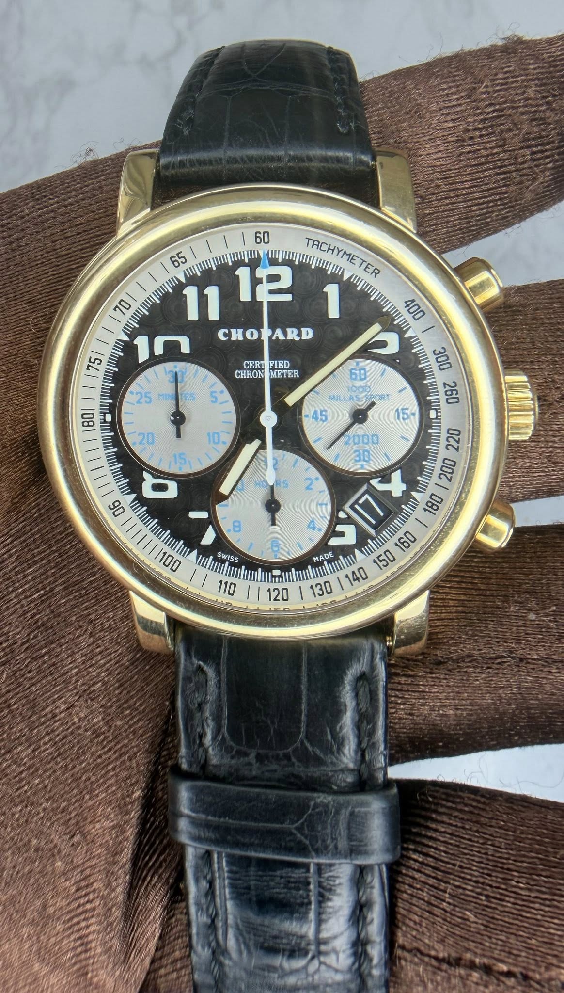 May be an image of wrist watch and text