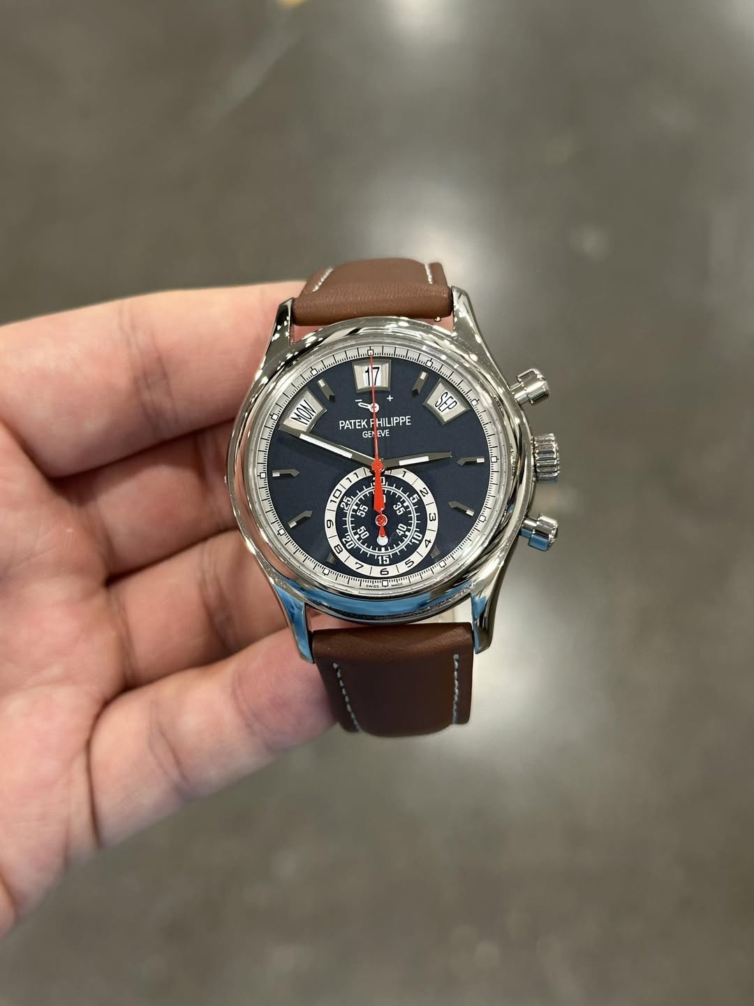 May be an image of wrist watch and text