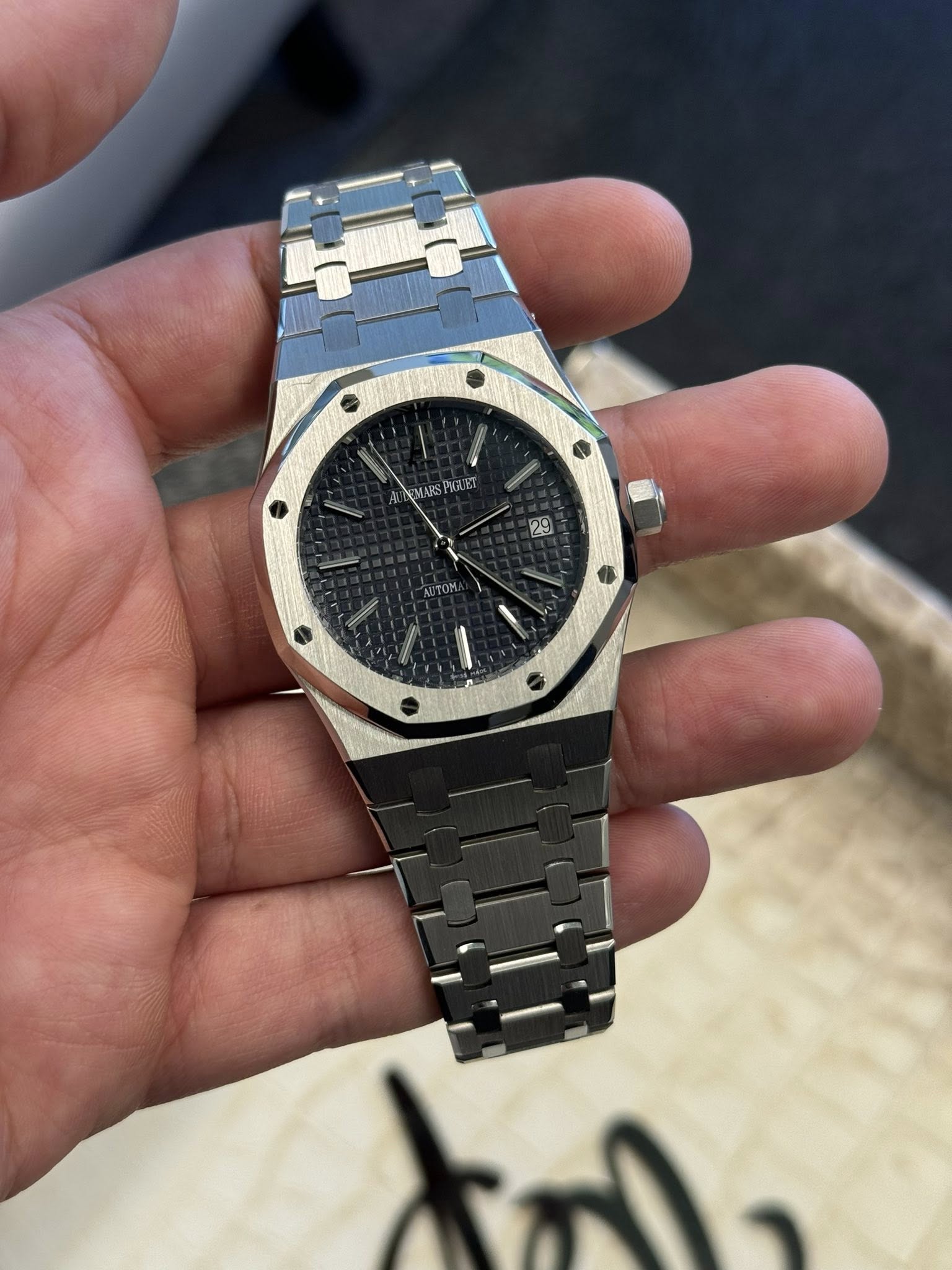 May be an image of wrist watch and text