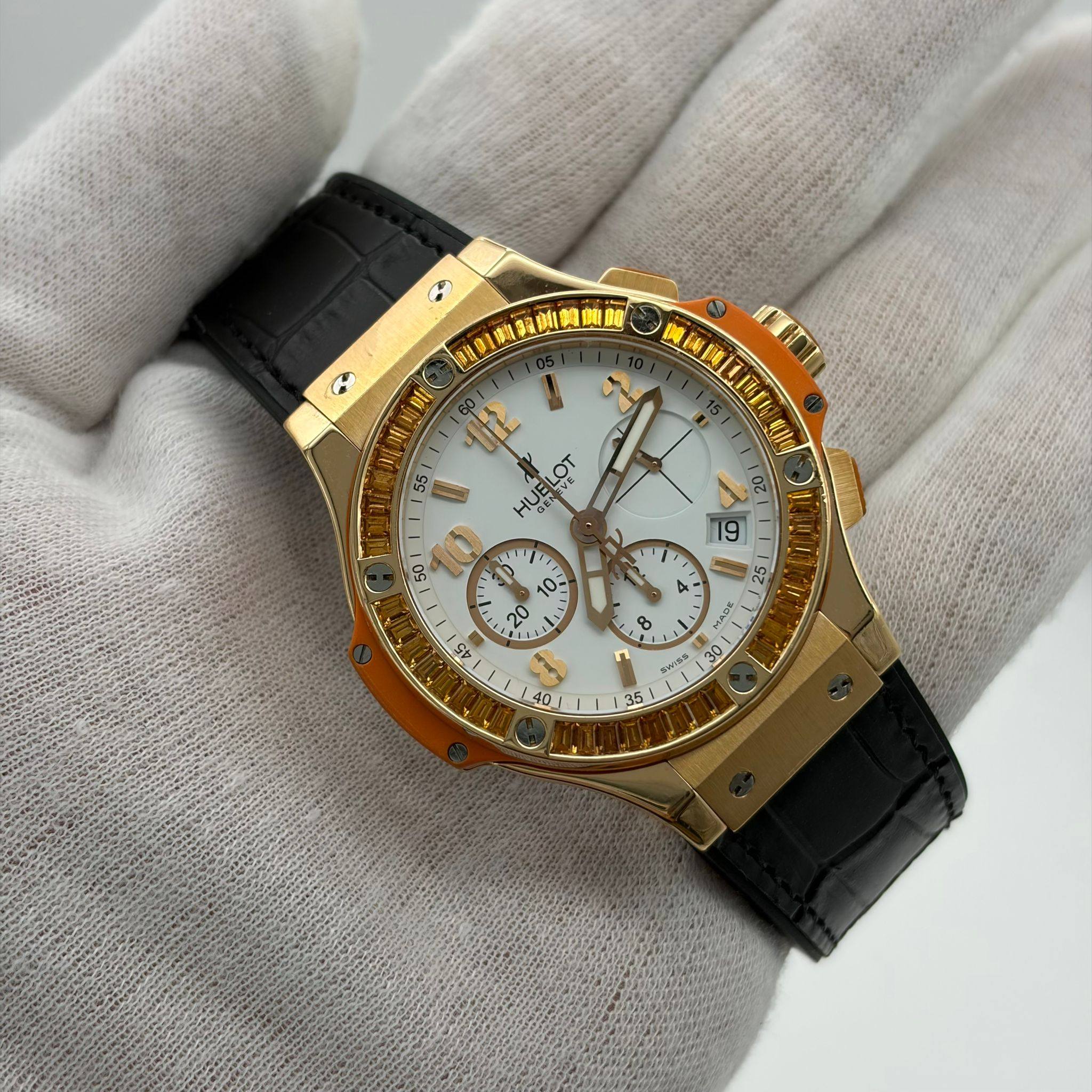 May be an image of wrist watch and text