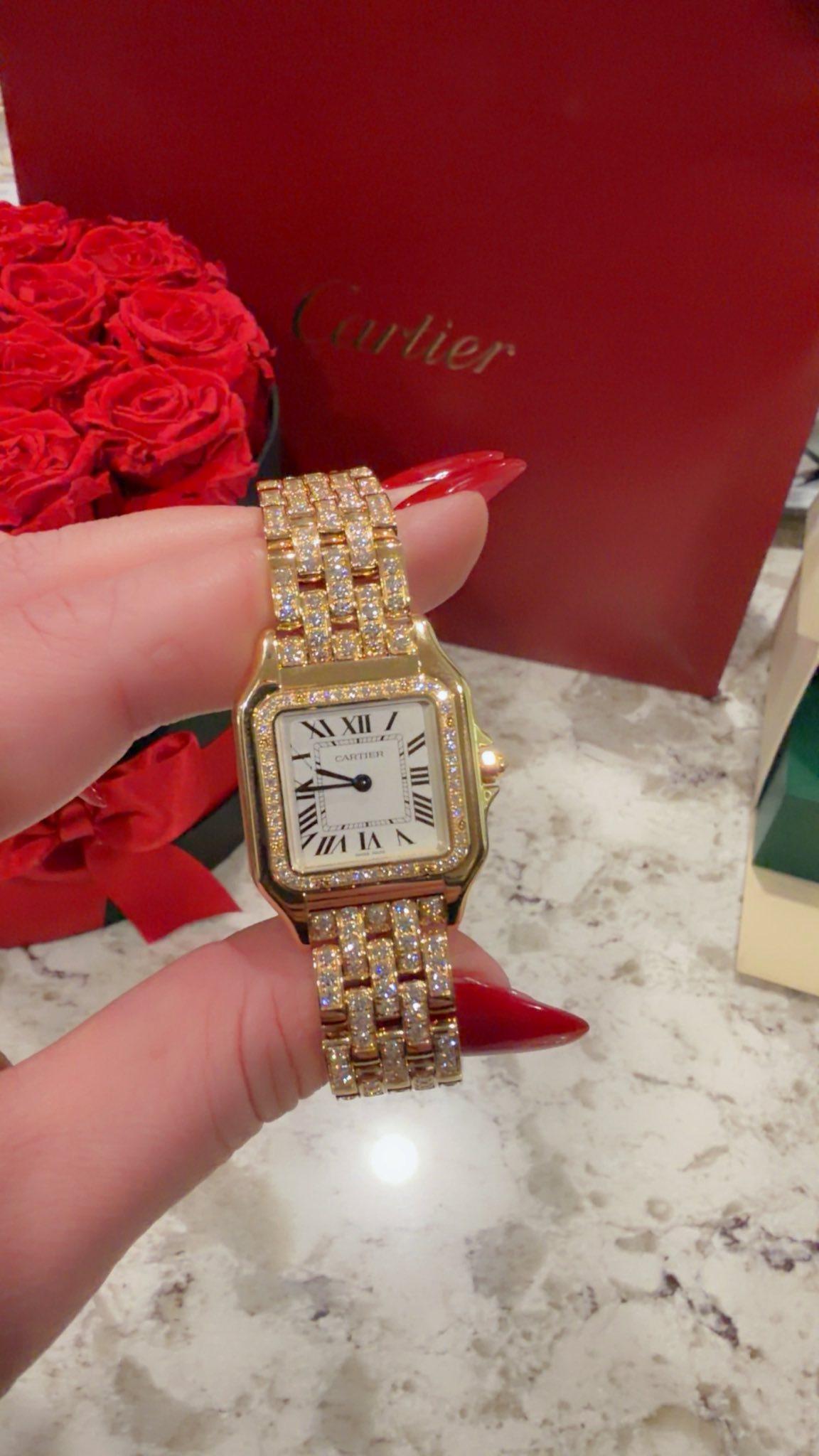 May be an image of wrist watch and text