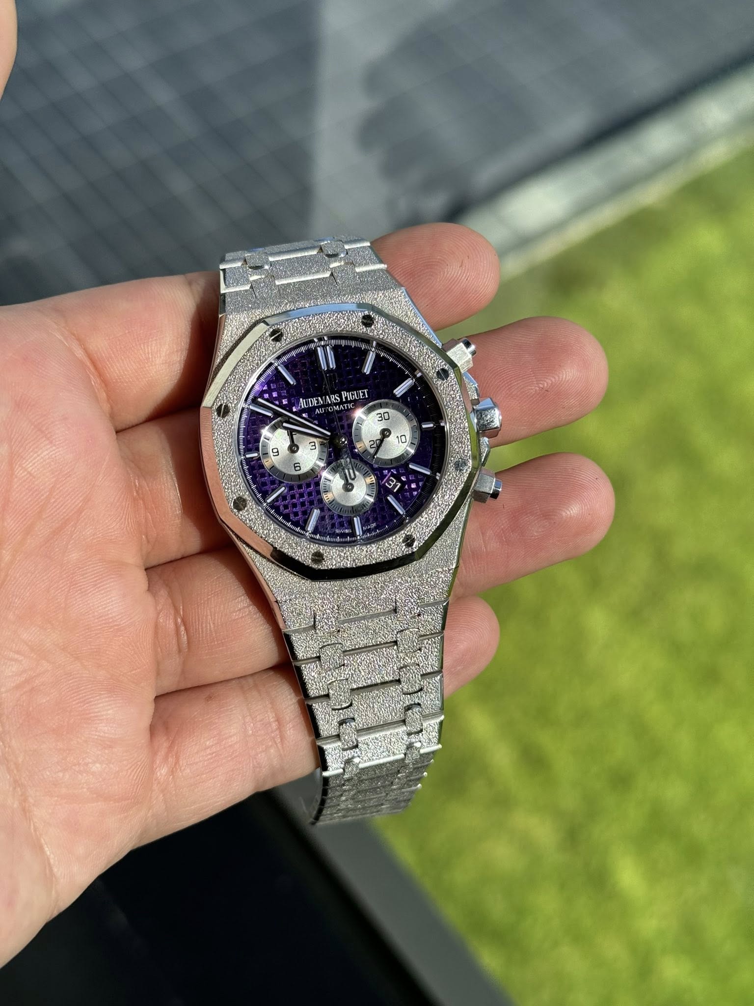 May be an image of wrist watch and text