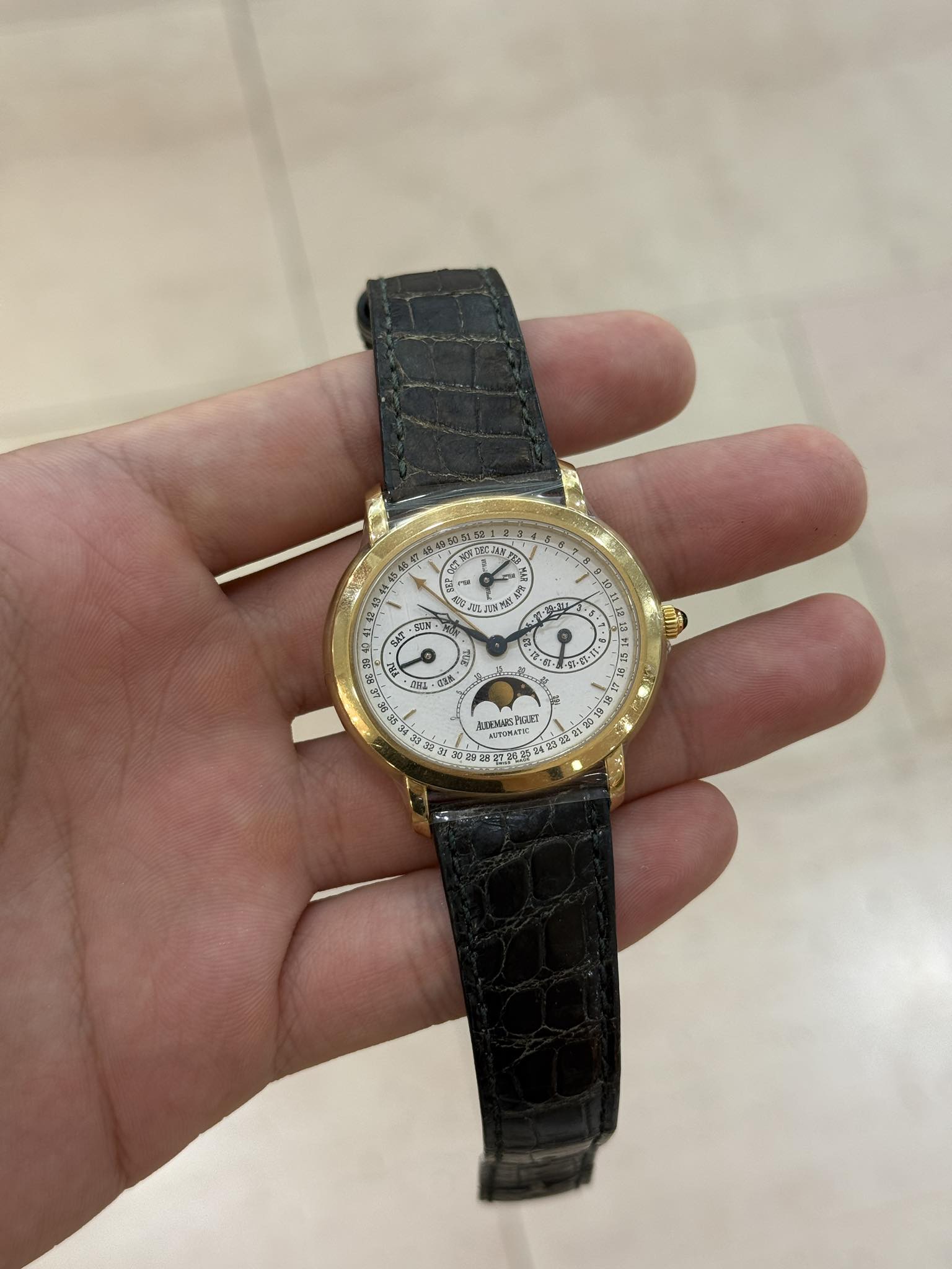 May be an image of wrist watch and text