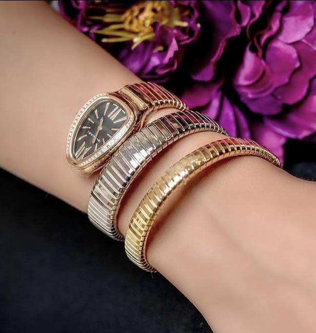 May be an image of wrist watch, jewelry and text that says 'RA TI'