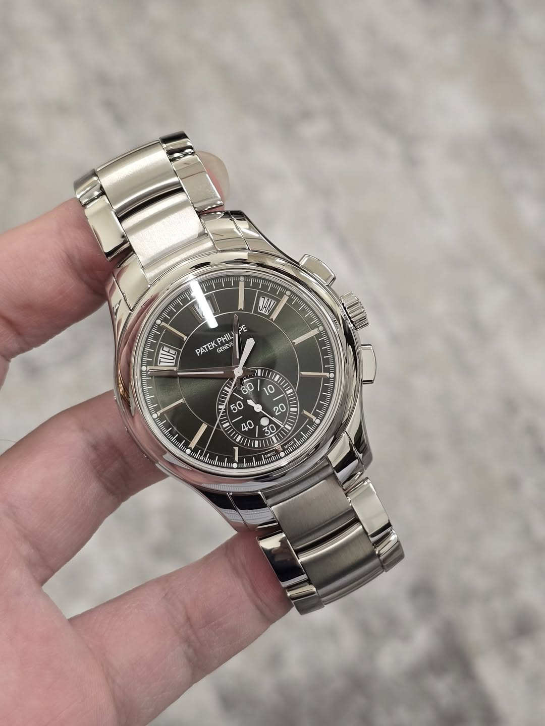 May be an image of wrist watch and text