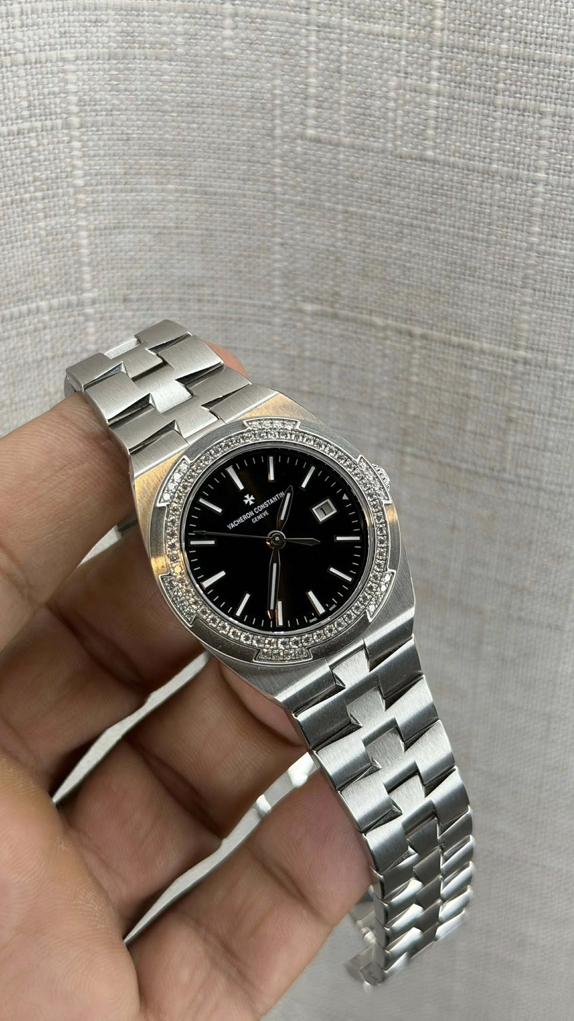 May be an image of wrist watch and text