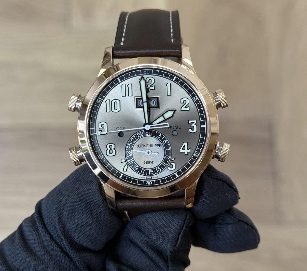 May be an image of wrist watch and text that says ' LOCAI 29 3 الس اته 23 PATEK PHILIPPE र מכח 40 8 GENEVE 4 G J ل 5 5 Phags ር'