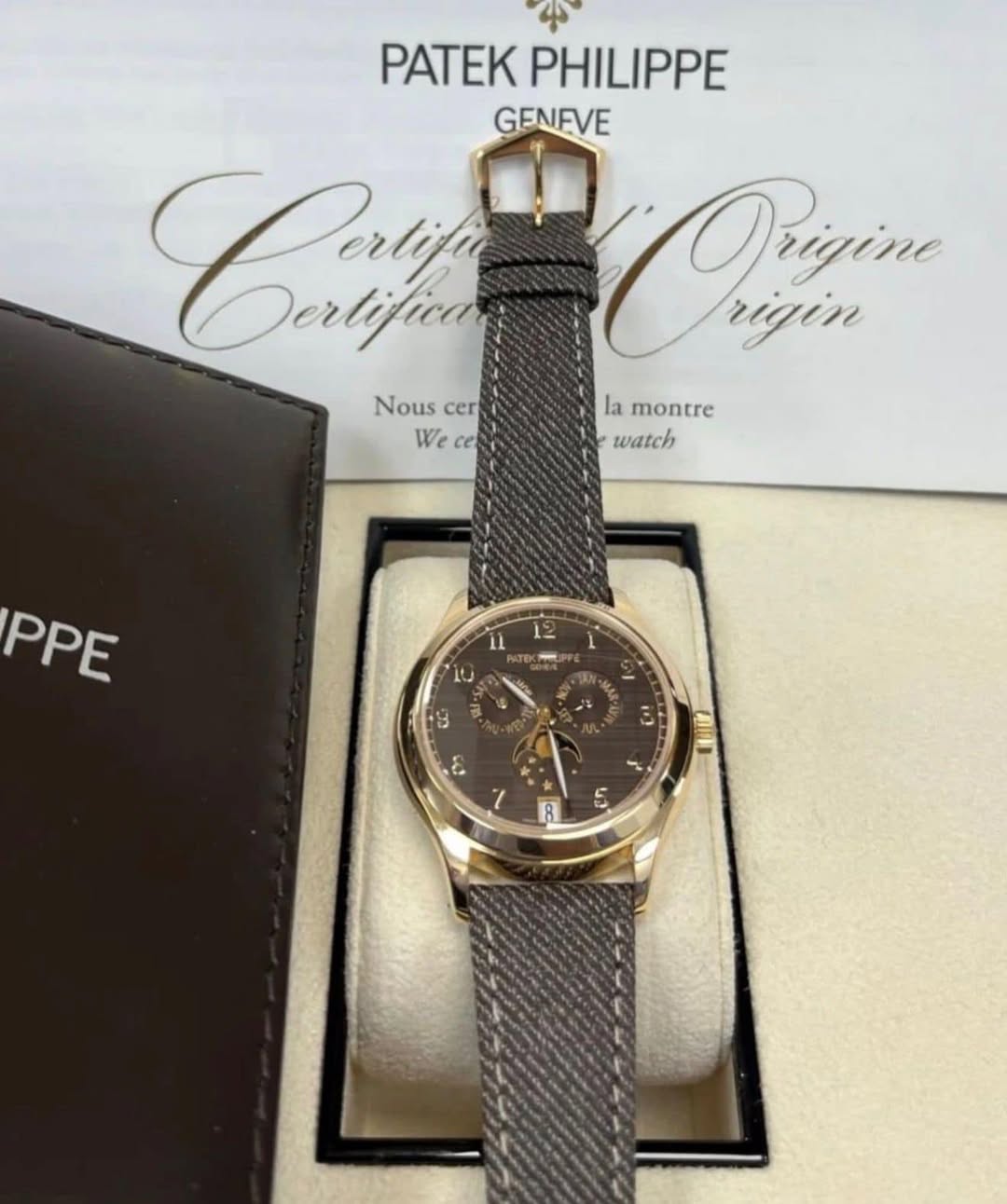 May be an image of wrist watch and text that says 'PATEK PHILIPPE GENFVE Caf Derlifica Orain Prizim rigin Nous Nouscer cer la montre Wece ce We watch PPE 9 3 င် COIn 8 42'