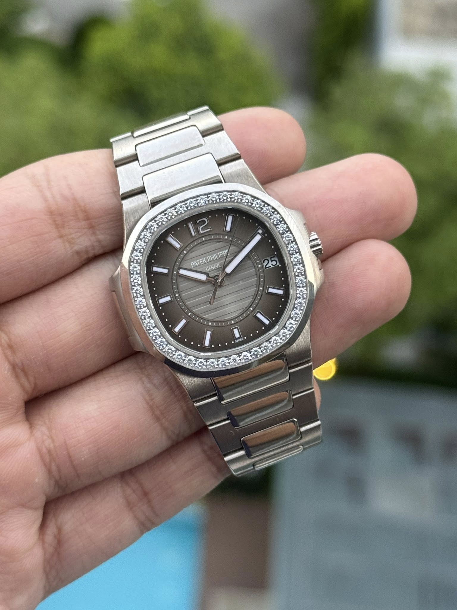 May be an image of wrist watch and text that says '2 PATEKPHILIPP 23'