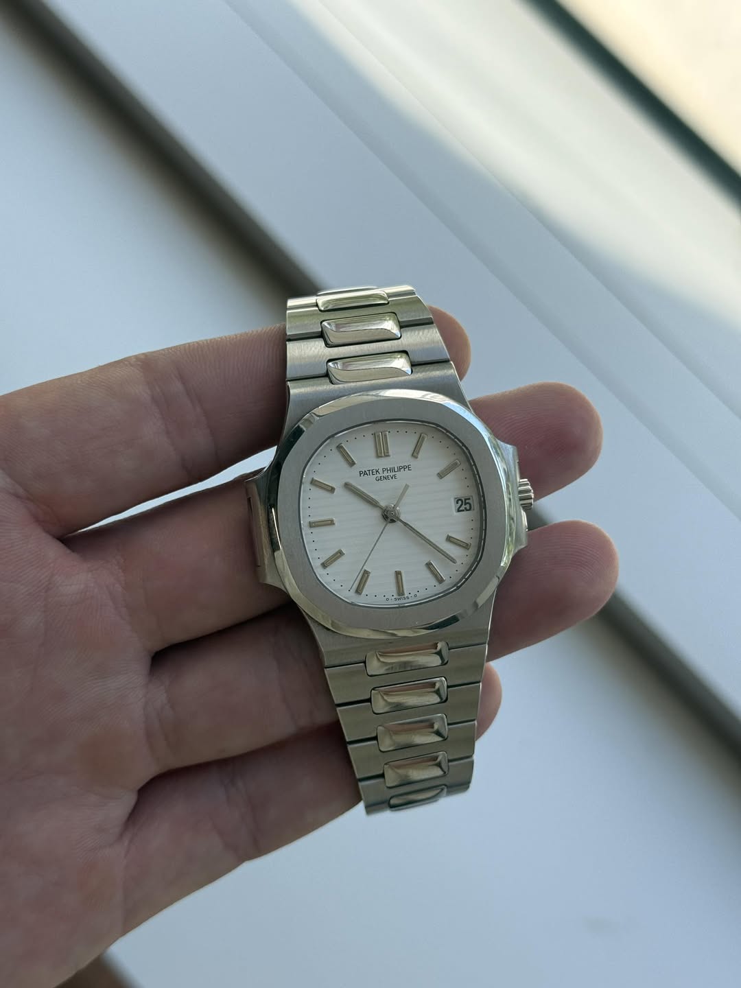 May be an image of wrist watch and text