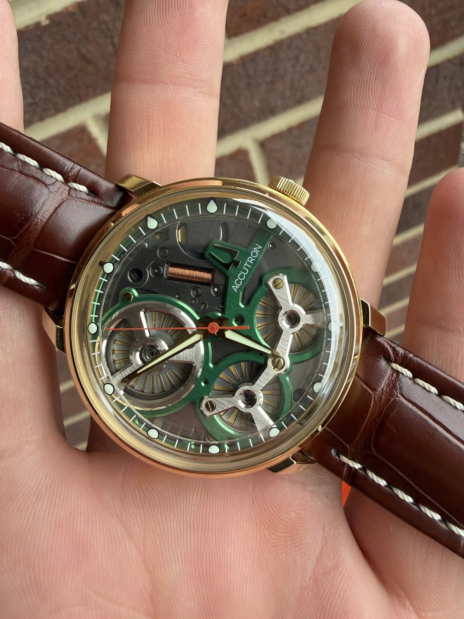 May be an image of wrist watch and text