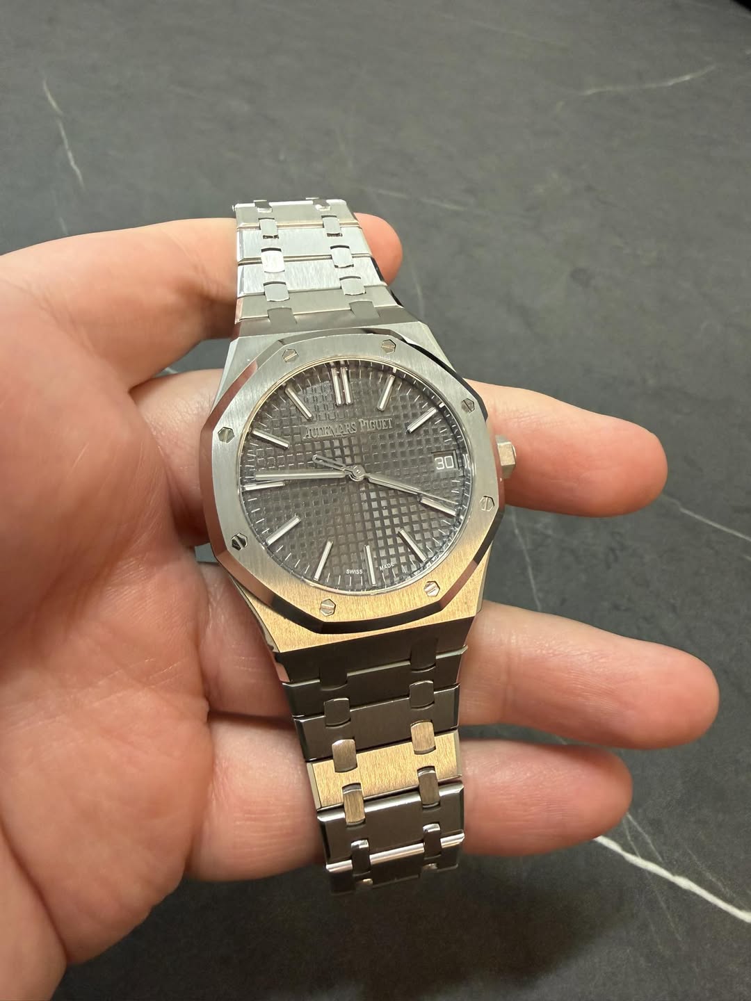 May be an image of wrist watch and text
