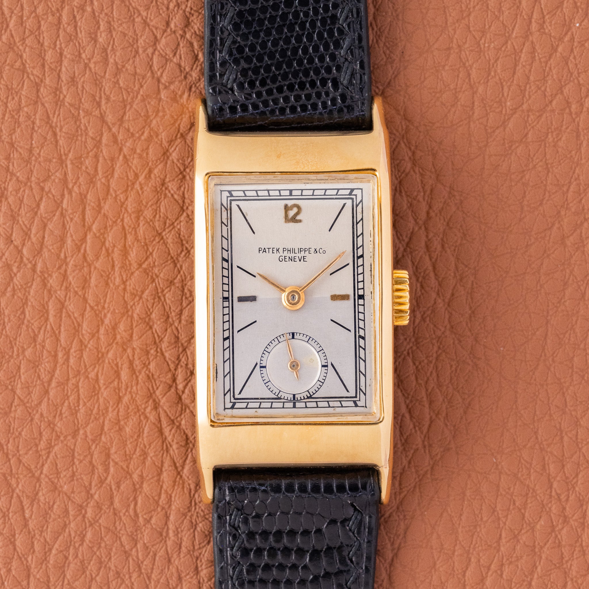 May be an image of leather and wrist watch