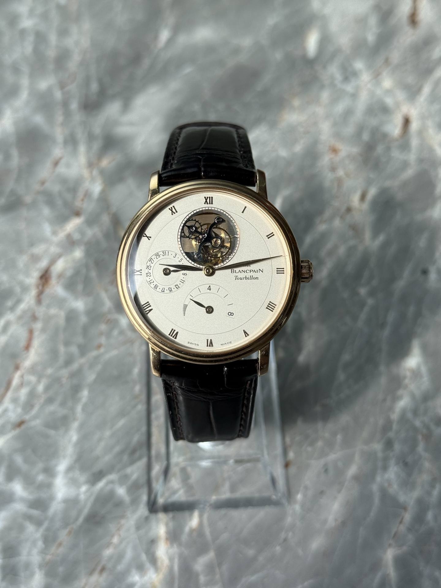 May be an image of wrist watch and text