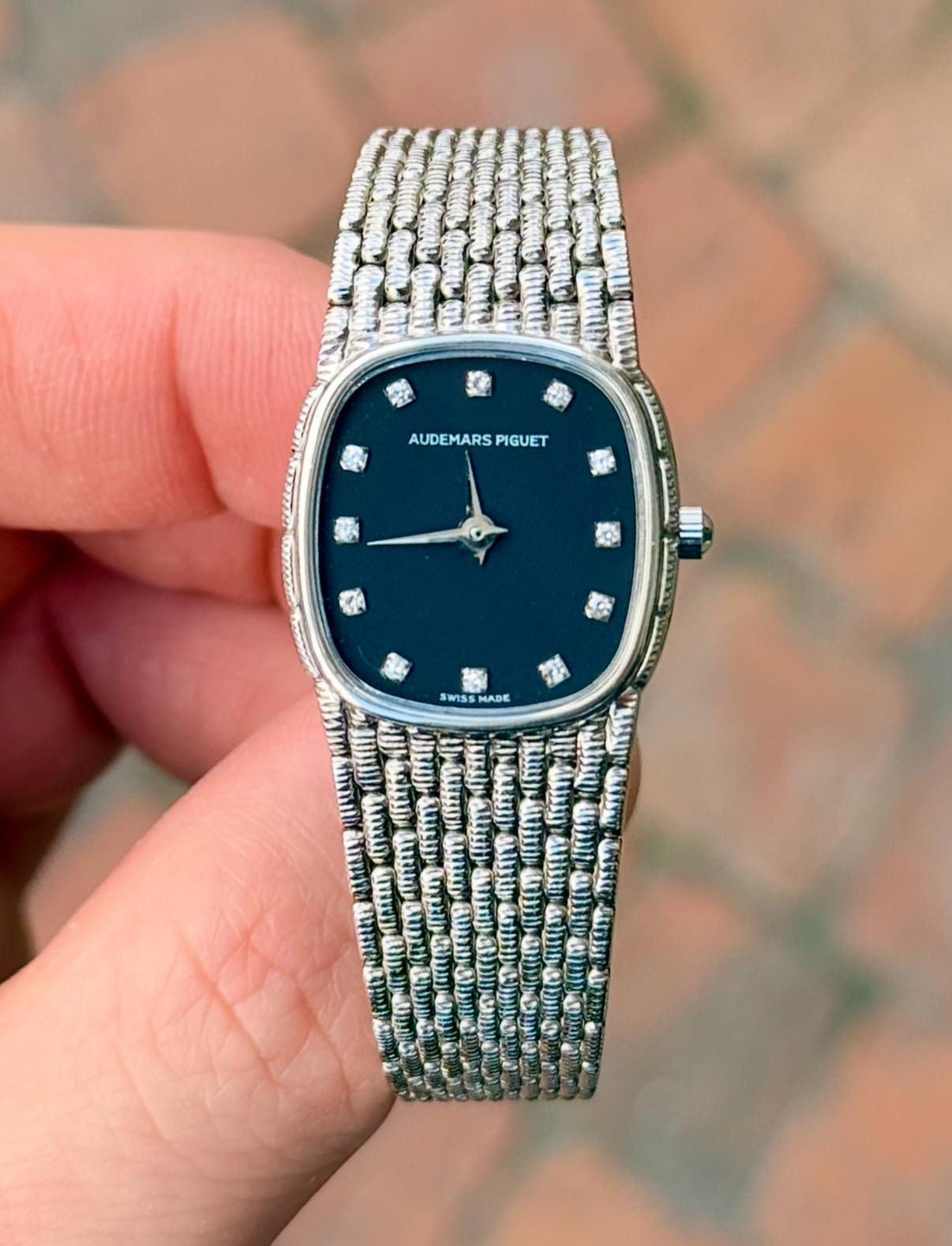 May be an image of wrist watch and text