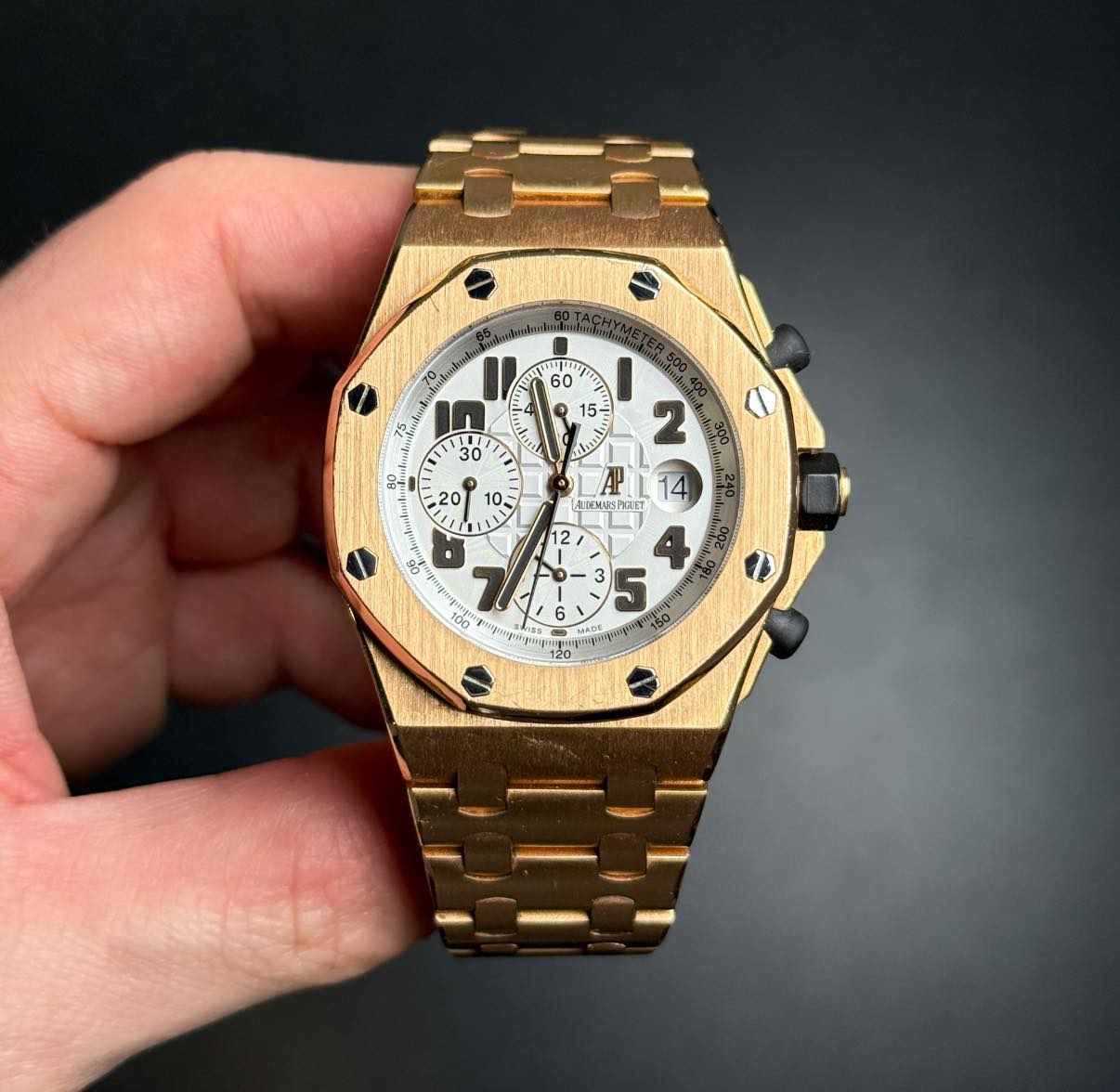 May be an image of wrist watch and text